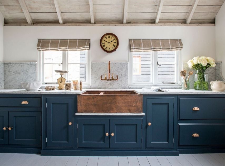 Dark blue kitchen cabinetry painted with Bond Street No.219

