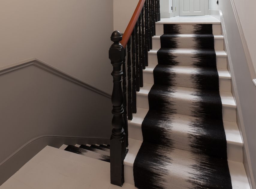 Black bannisters painted with Downing Street No.10

