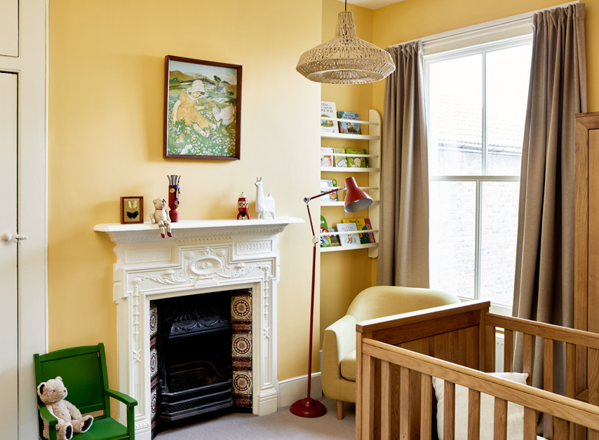 Bright orange yellow walls in a children's bedroom painted with Golden Square No.131

