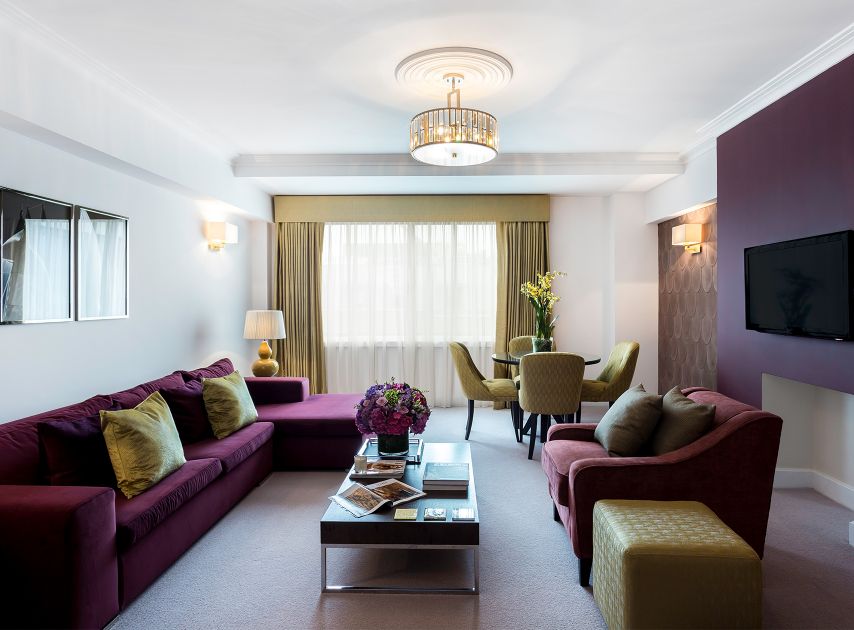 Brown magenta living room wall painted with Rothschild Street No.296

