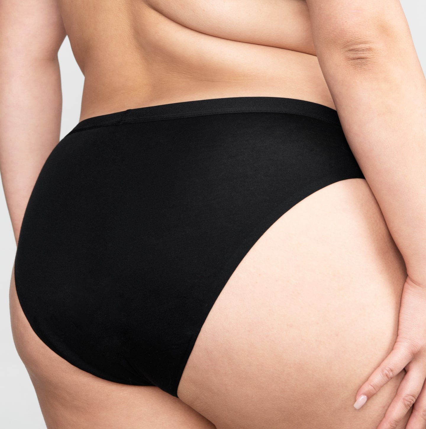 A person wearing a pair of Free-to-Flow Period Underwear