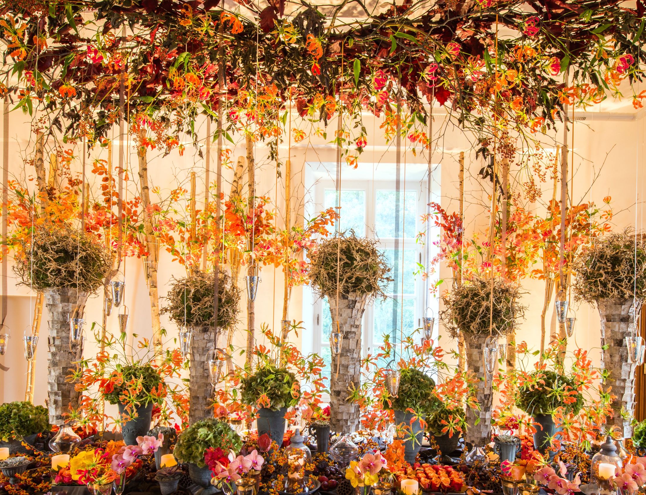 Autumn themed ceiling and table floral display.