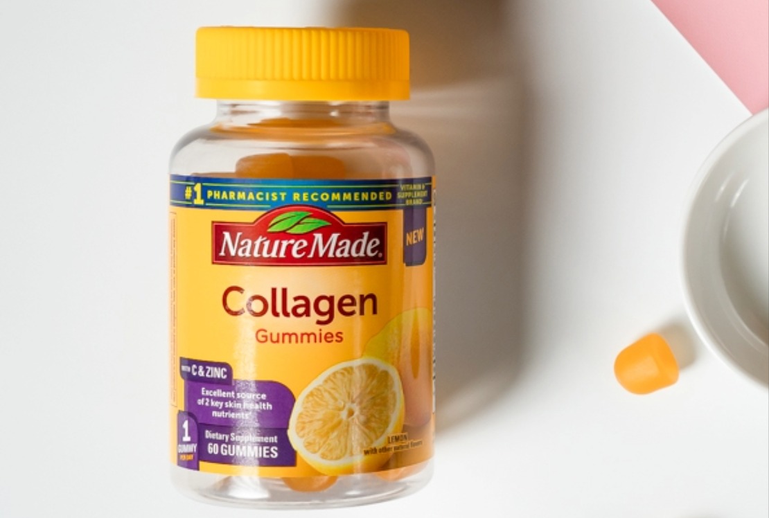 Nature Made Collagen Gummies bottle on a white surface with a bowl