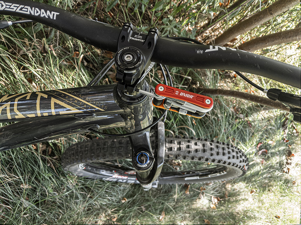 A Unior multitool is used to adjust a twisted stem