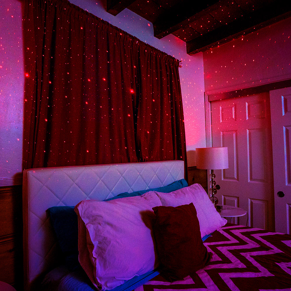 bedroom with red blissbulb laser lightbulb star projector