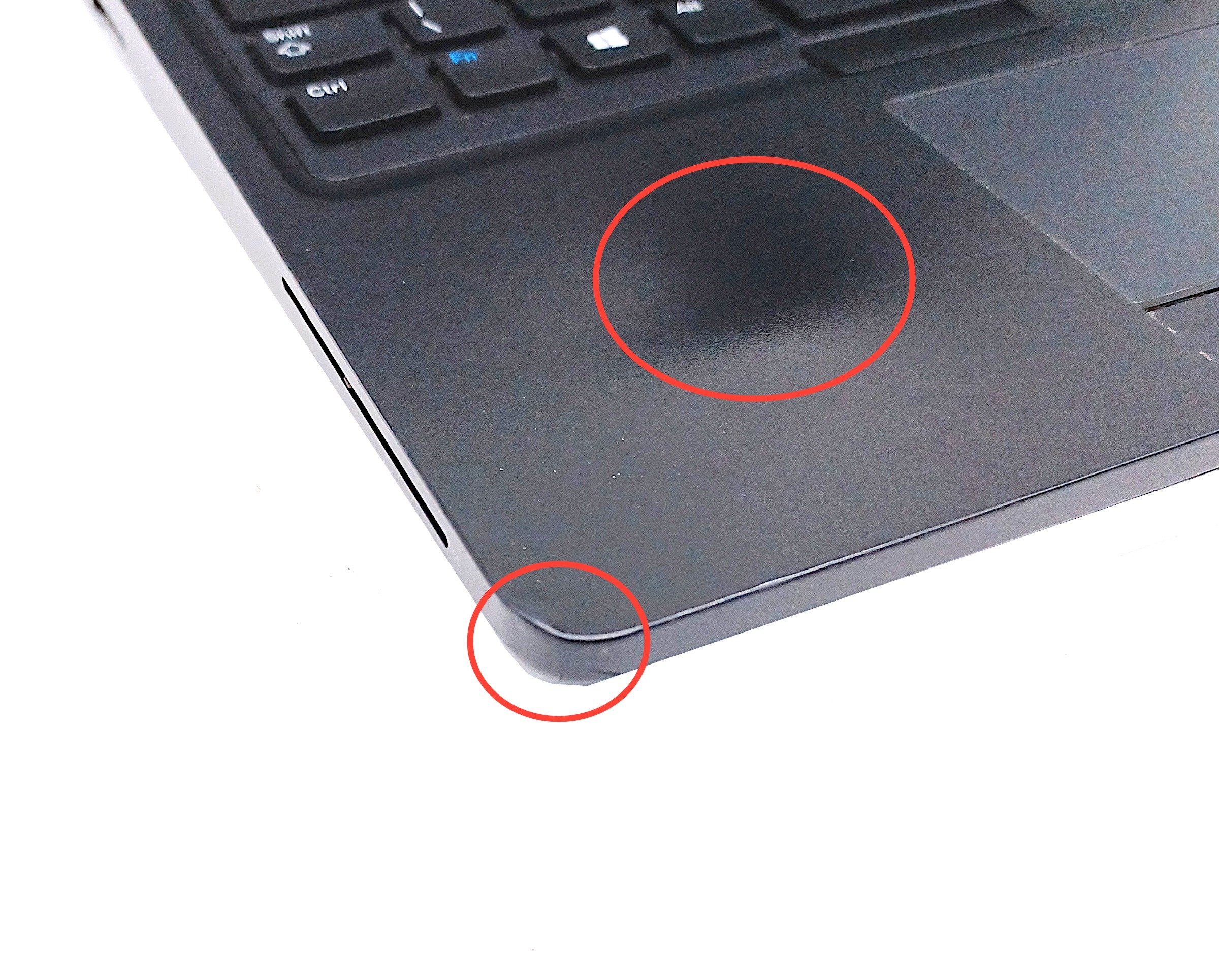 Device #3 - Shiny palm rest and small dent to corner