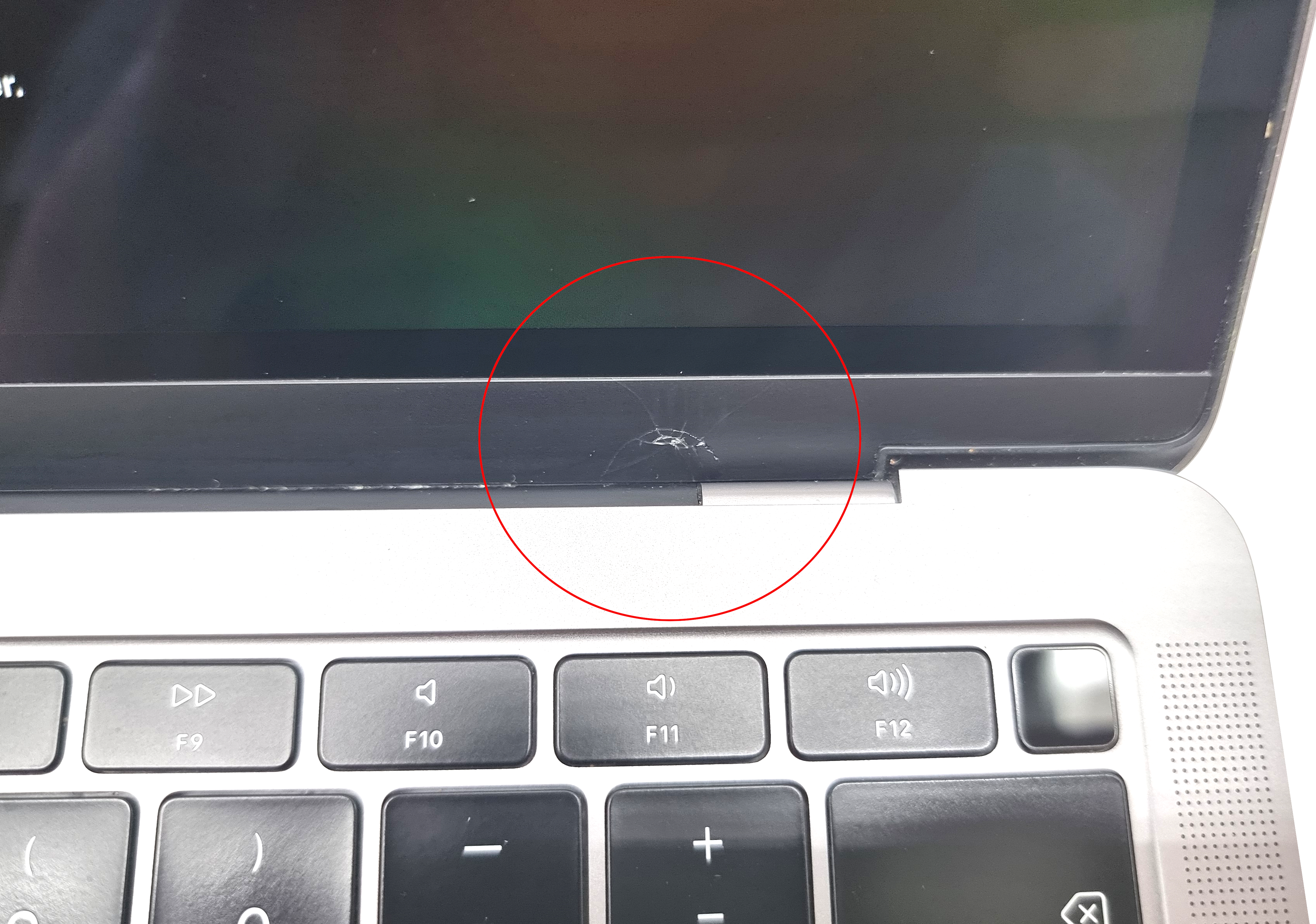 Device #1 - Small crack on the bottom right of the bezel