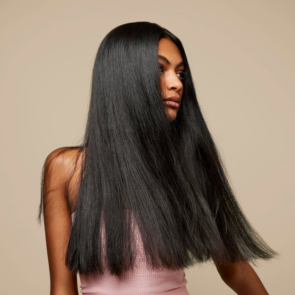 Woman with long, thick, straight black hair. 