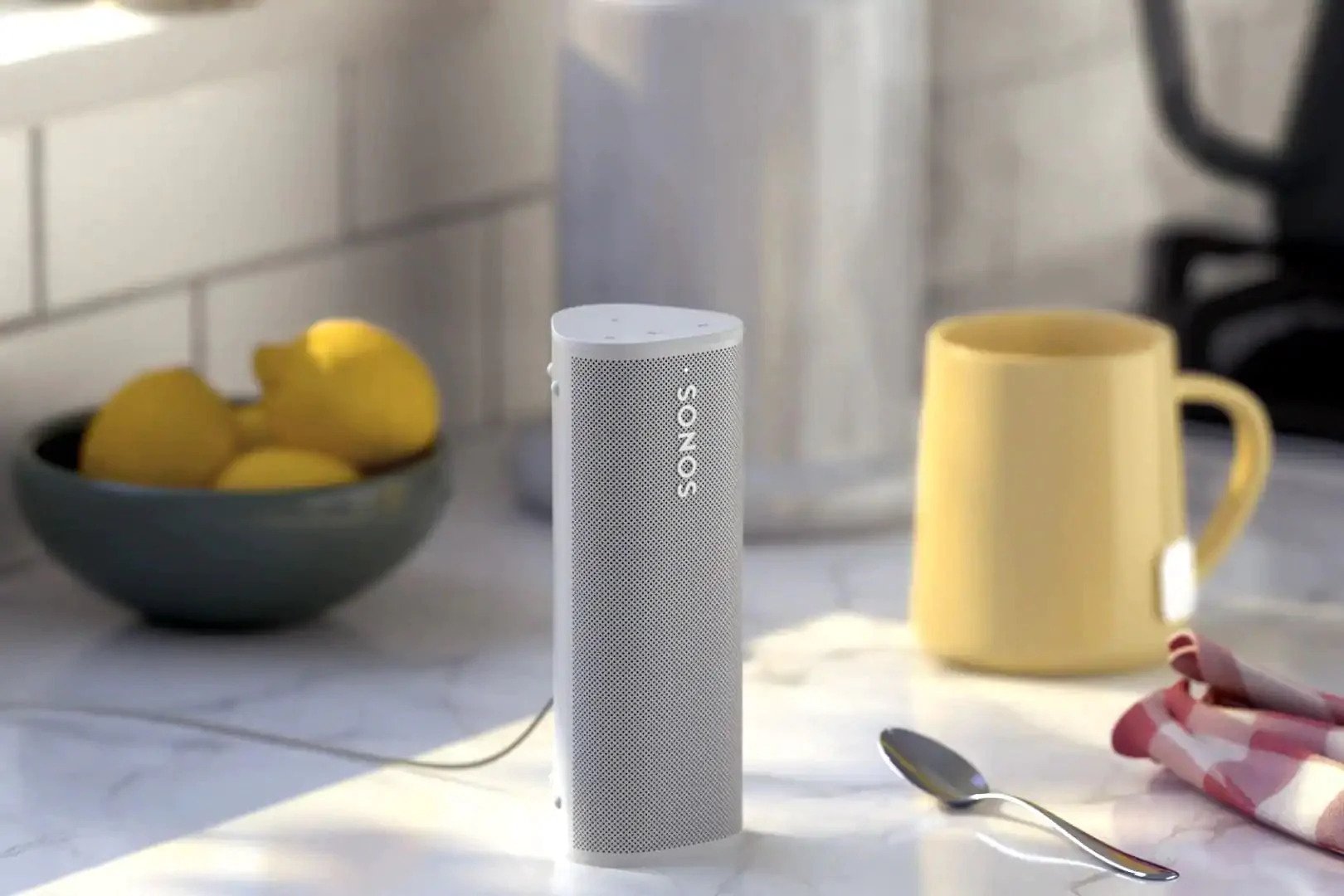 White Sonos Roam on kitchen tabletop