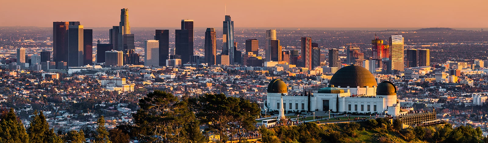 Los Angeles skyscrapers and Griffith Observatory at sunset
