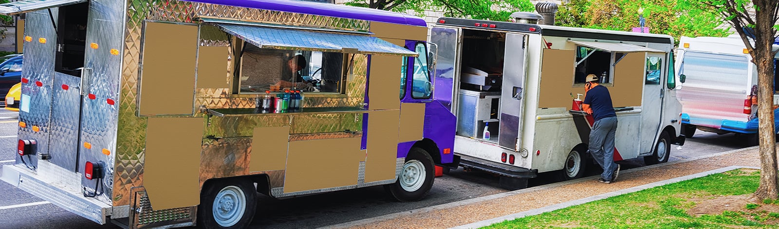 Two food trucks in the street