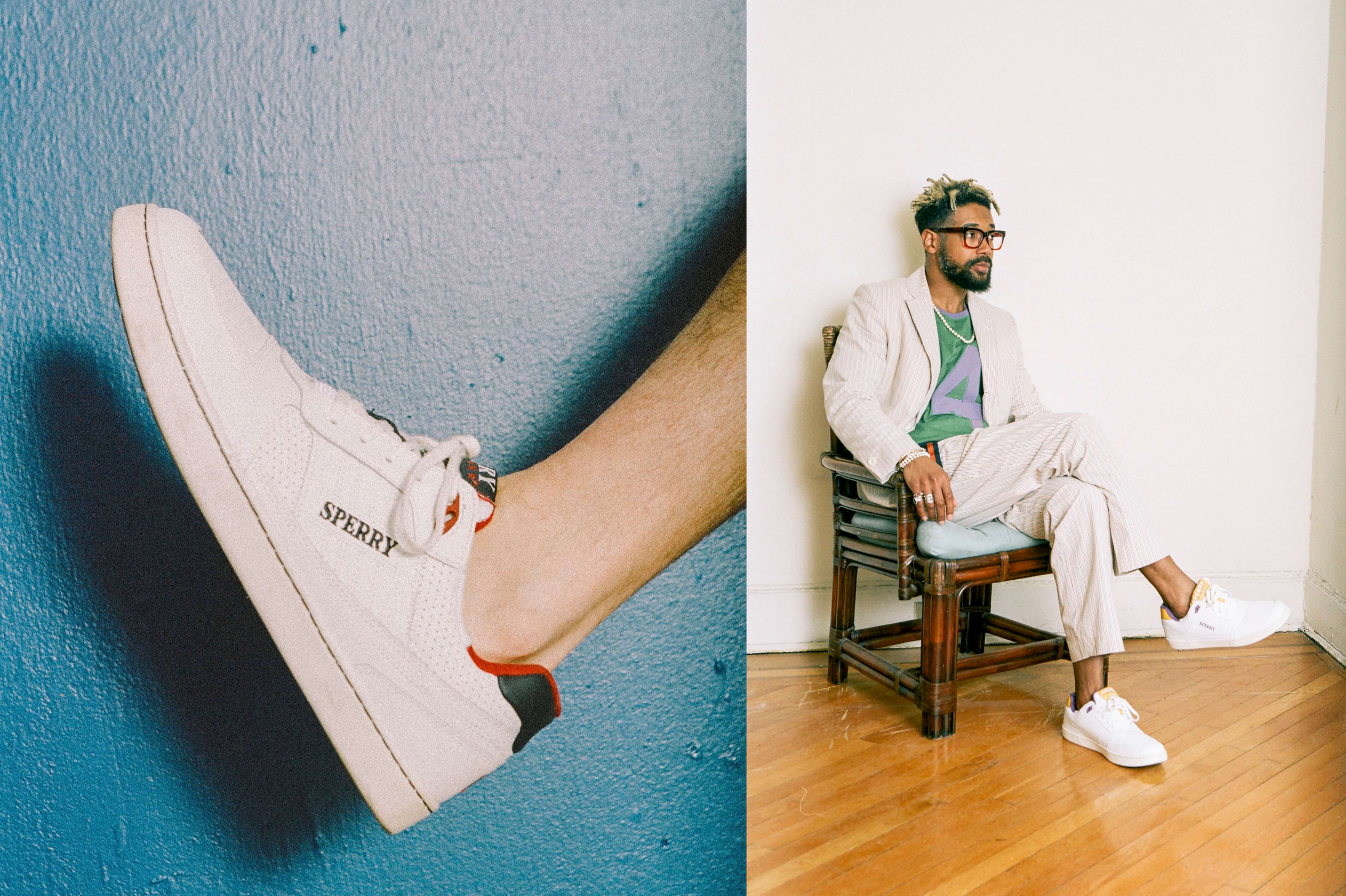 Male model wearing the Sperry x Rowing Blazers Cloud Cup Sneaker in navy and red. Male model wearing the Original Number Tee #4 in purple color block, the Croquet Seersucker Blazer and the Croquet Seersucker Tailored Trousers 