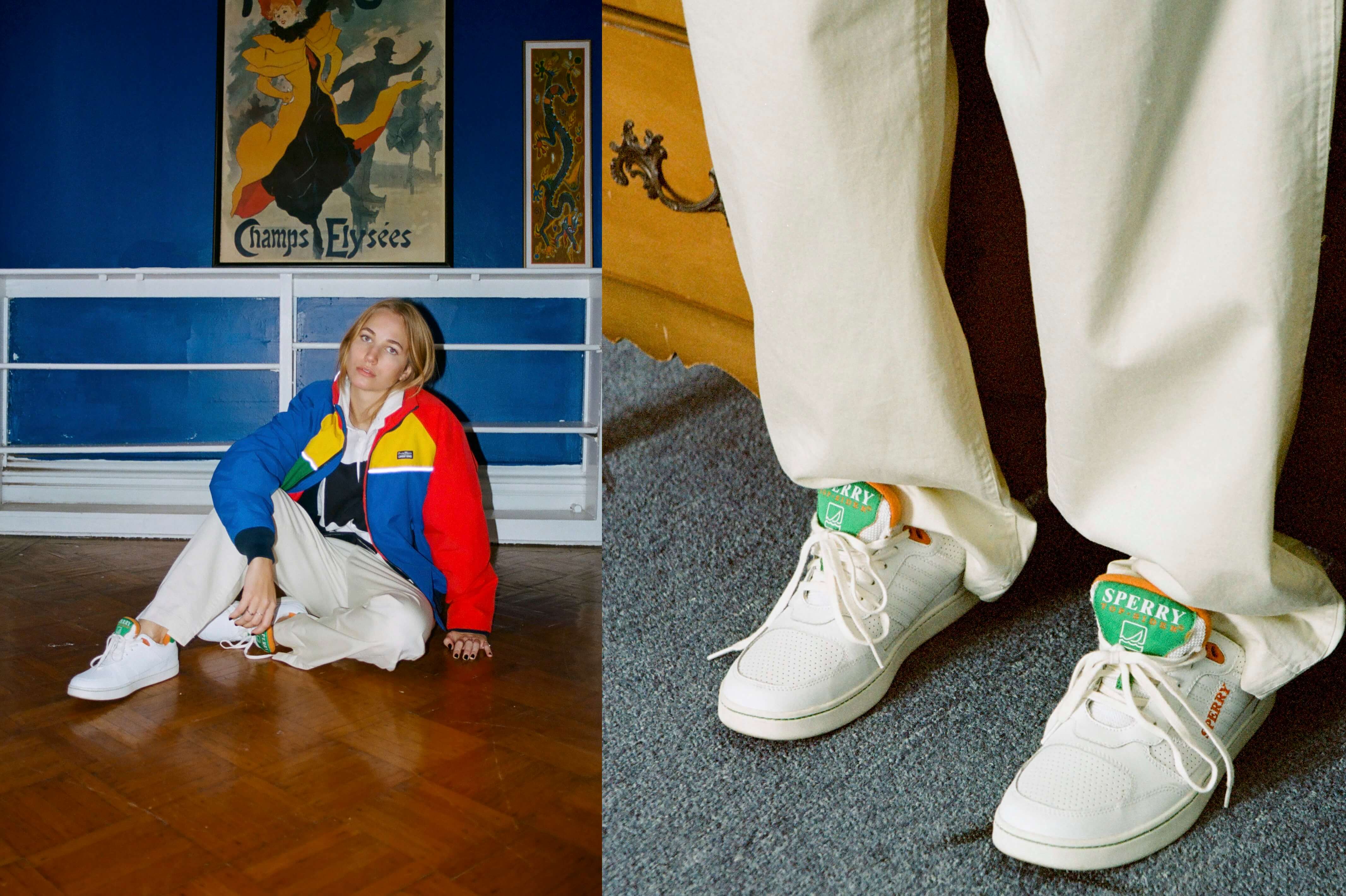 Female model wearing the Checkered Rugby, Cream Twill Wide Leg Trousers, the Rowing Blazers X Lands' End Og Colorblock Lightweight Spring Squall Sailing Jacket  and the Sperry x Rowing Blazers Cloud Cup Sneaker in orange and green