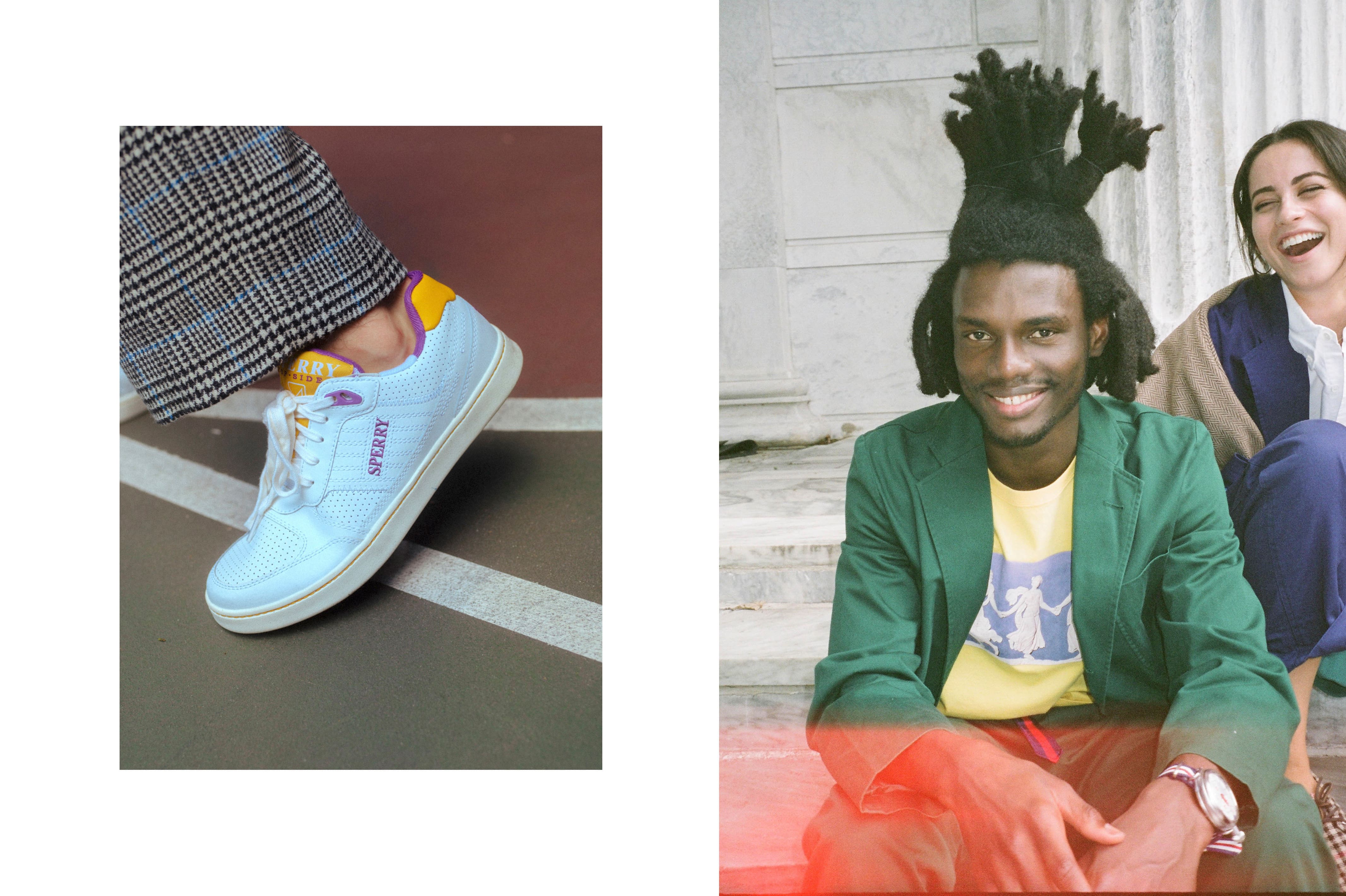Male model wearing the Sperry x Rowing Blazers Cloud Cup Sneaker in purple and gold. Male model wearing the Wedgewood Tee, the Cotton Twill Tailored Trousers in green and the Grosgrain Belt in blue and red