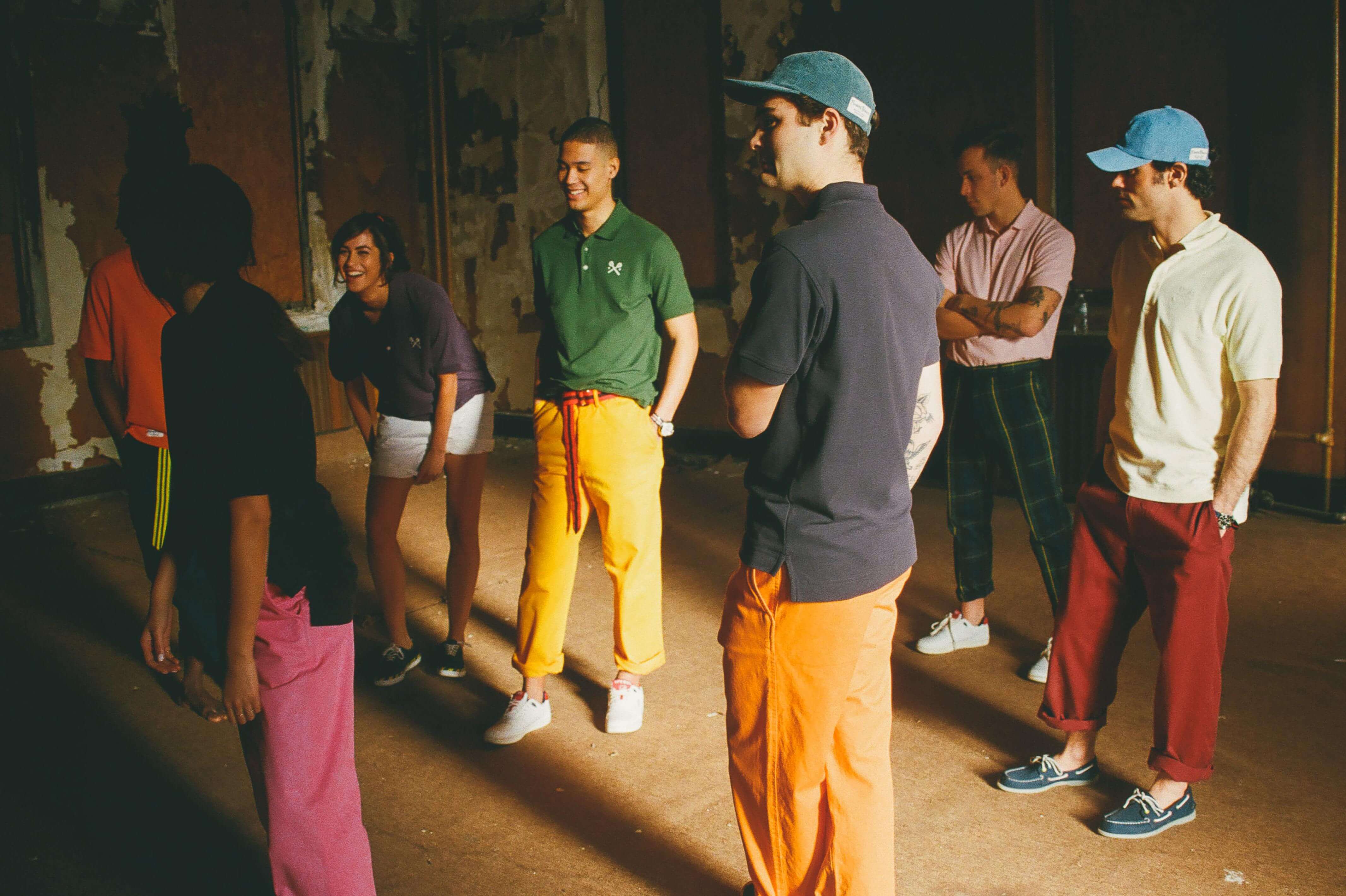 Male model wearing the Gordon Modern Japanese Cotton Tailored Trousers. Male model wearing Cotton Twill Tailored Trousers in pink. Male model wearing the Cotton Twill Tailored Trousers in orange. Male model wearing the Cotton Twill Tailored Trousers in gold