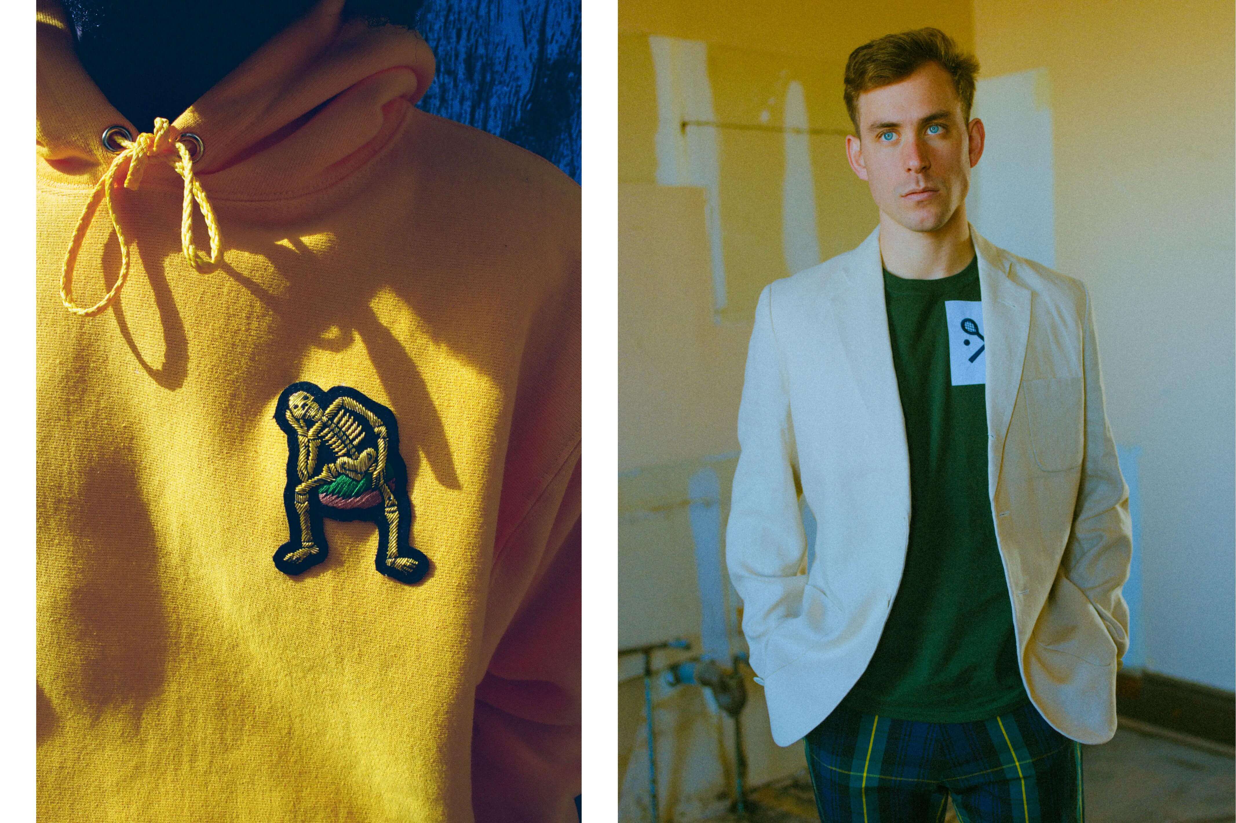 Male model wearing the Derry Bones Hoodie in yellow. Male model wearing the Green Racquets Short Sleeve Tee in green and the Gordon Modern Tartan Wide Leg Trousers 