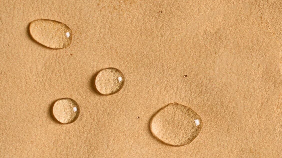 water droplets on a leather surface
