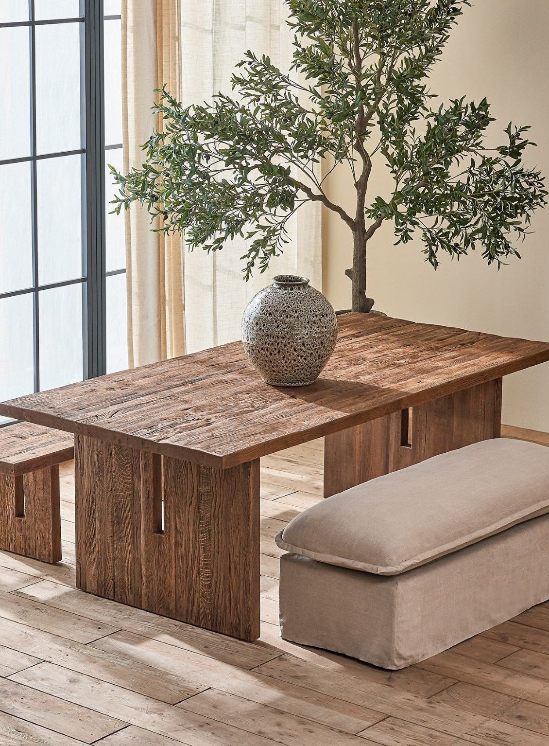 Neva Dining Bench placed around the Kai Dining Table in Heritage Oak