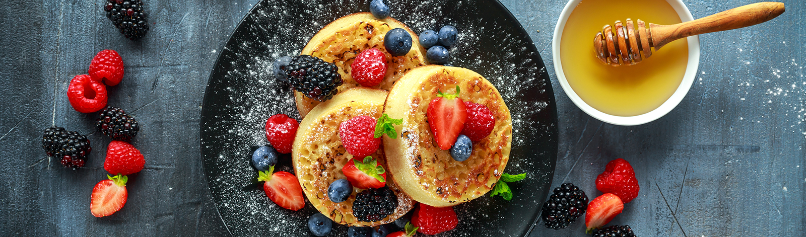 British crumpets with berries and honey