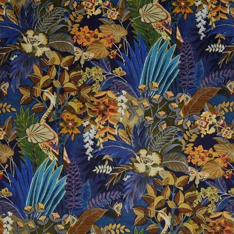 A closeup image of a velvet curtain design, with a blue-based multicolour print of tropical florals.