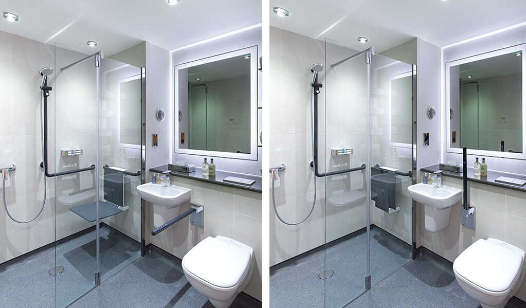 Image Split Screen
Image 1 - Bathroom with wall hung white toilet, small white basin and a bifolding shower screen which homes a wall hung charcoal coloured shower seat and L shaped shower rail. 
Image 2 - Bathroom with wall hung white toilet with handrail folded up, small white basin and a bifolding shower screen which homes a wall hung charcoal coloured shower seat folded up and L shaped shower.