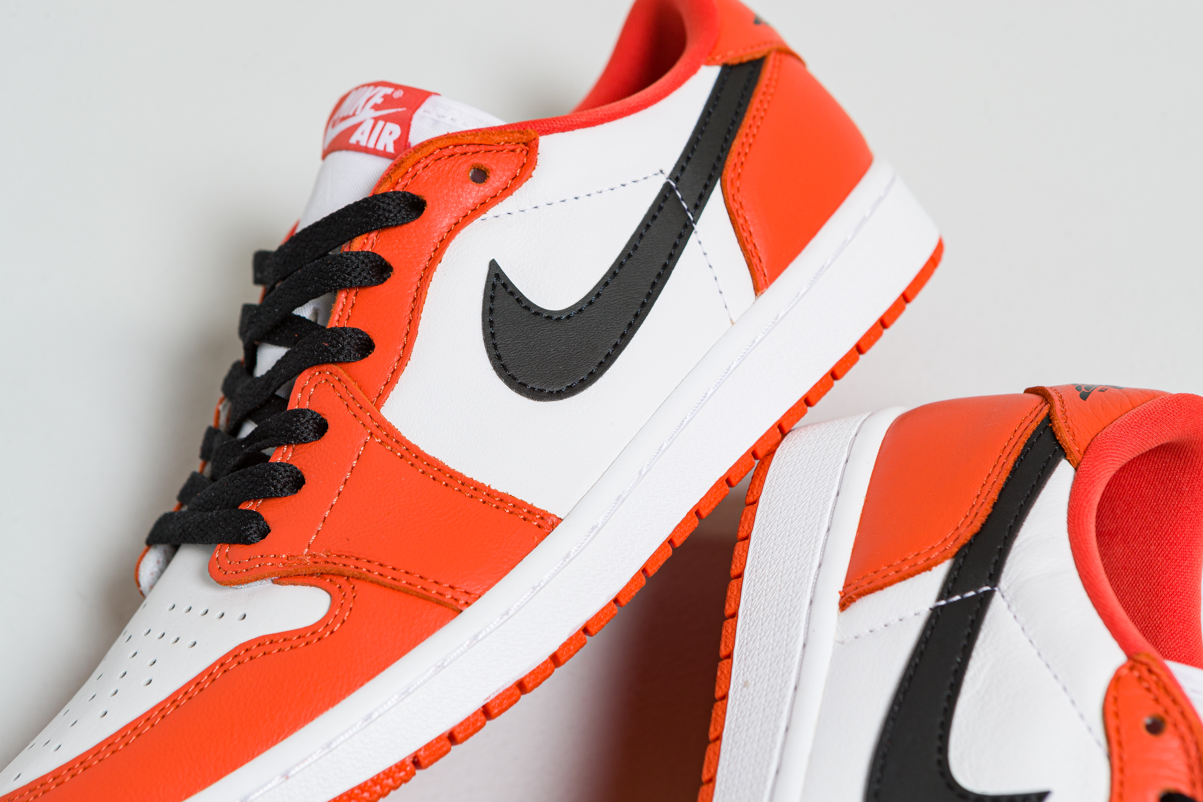 nike orange black and white shoes