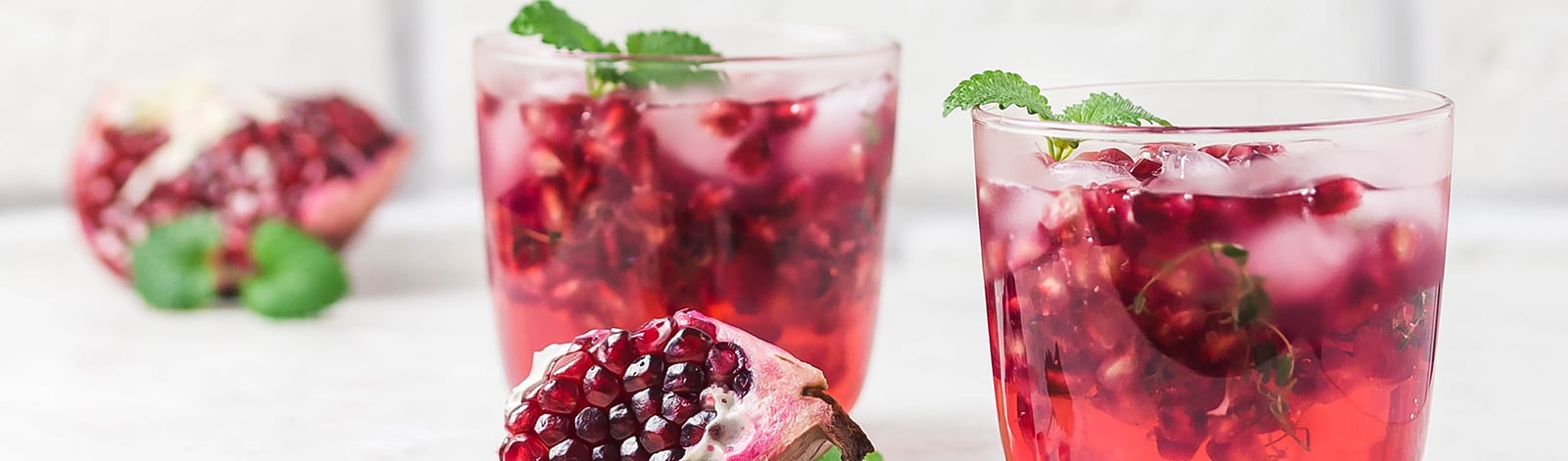 Two pomegranate kombucha cocktails