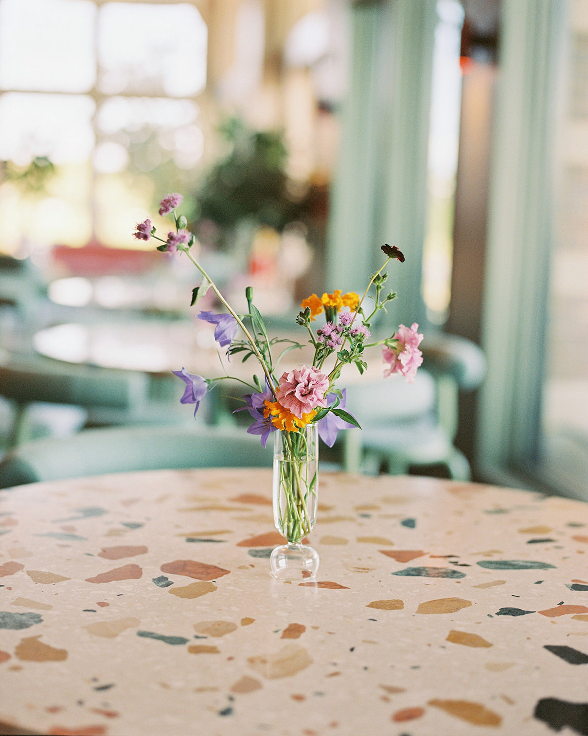 Florals displayed in glass vessel.