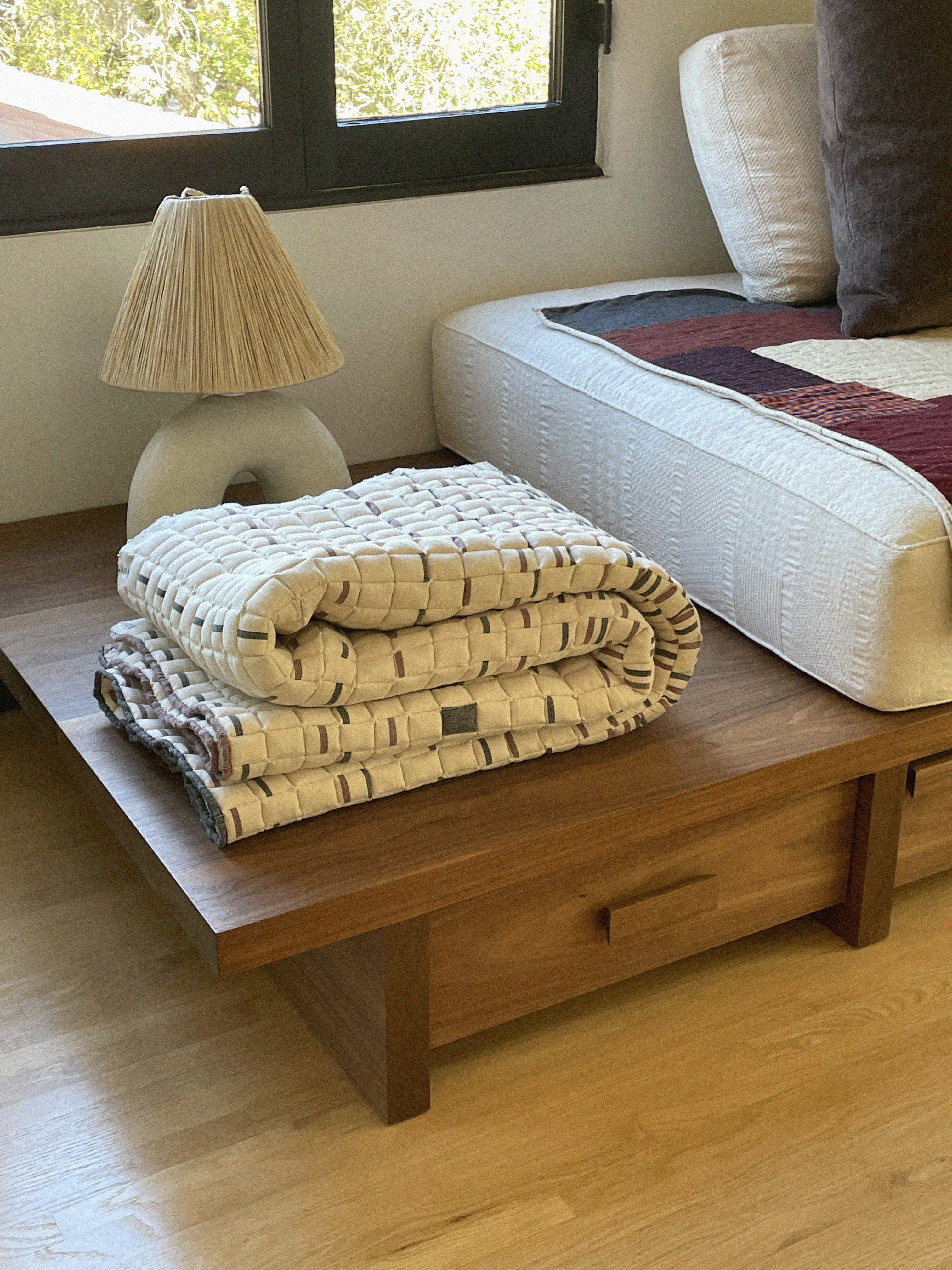 Quilt on table.