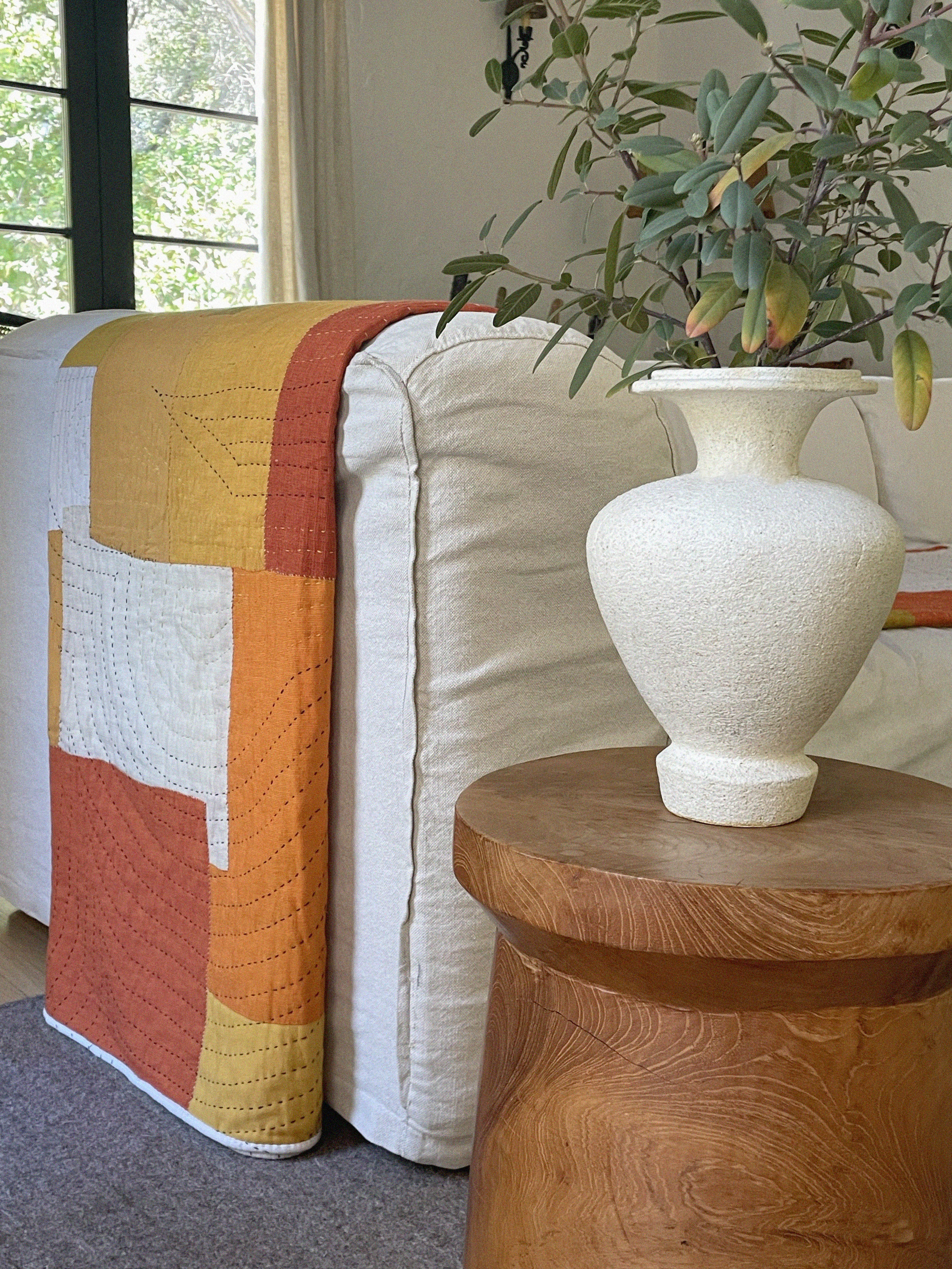 Quilt on couch.