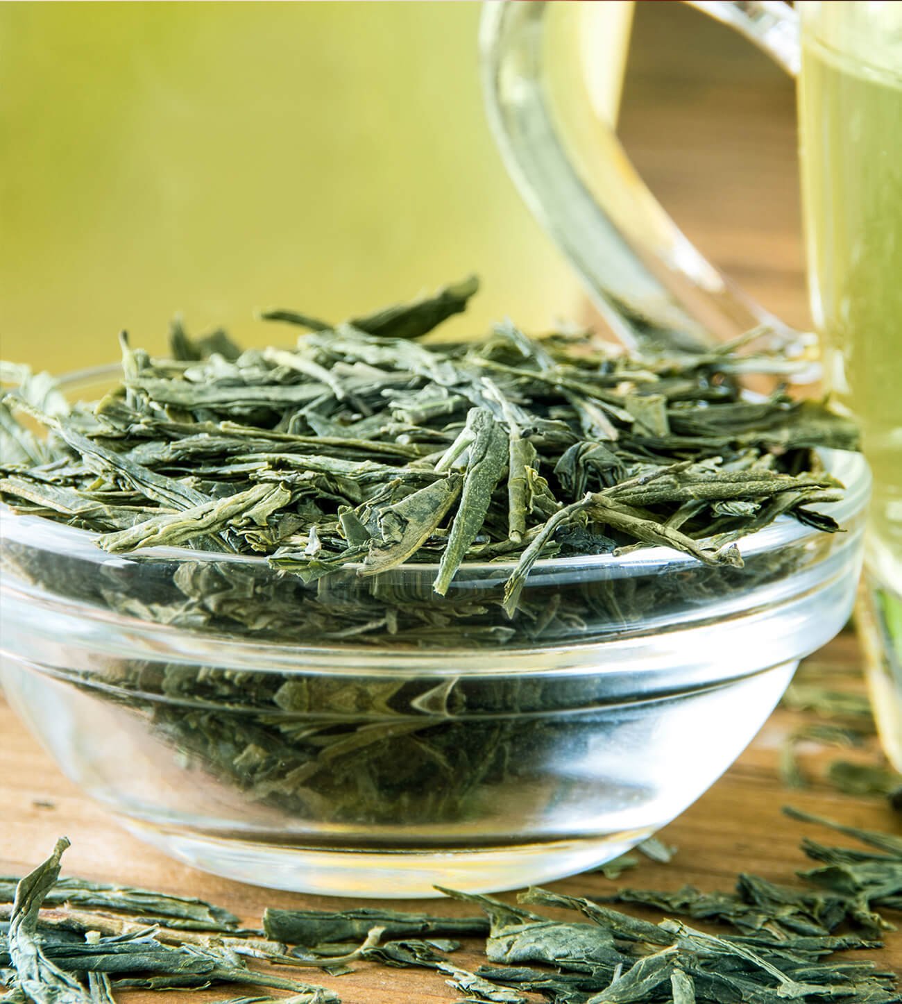 Loose leaf green tea in a glass bowl