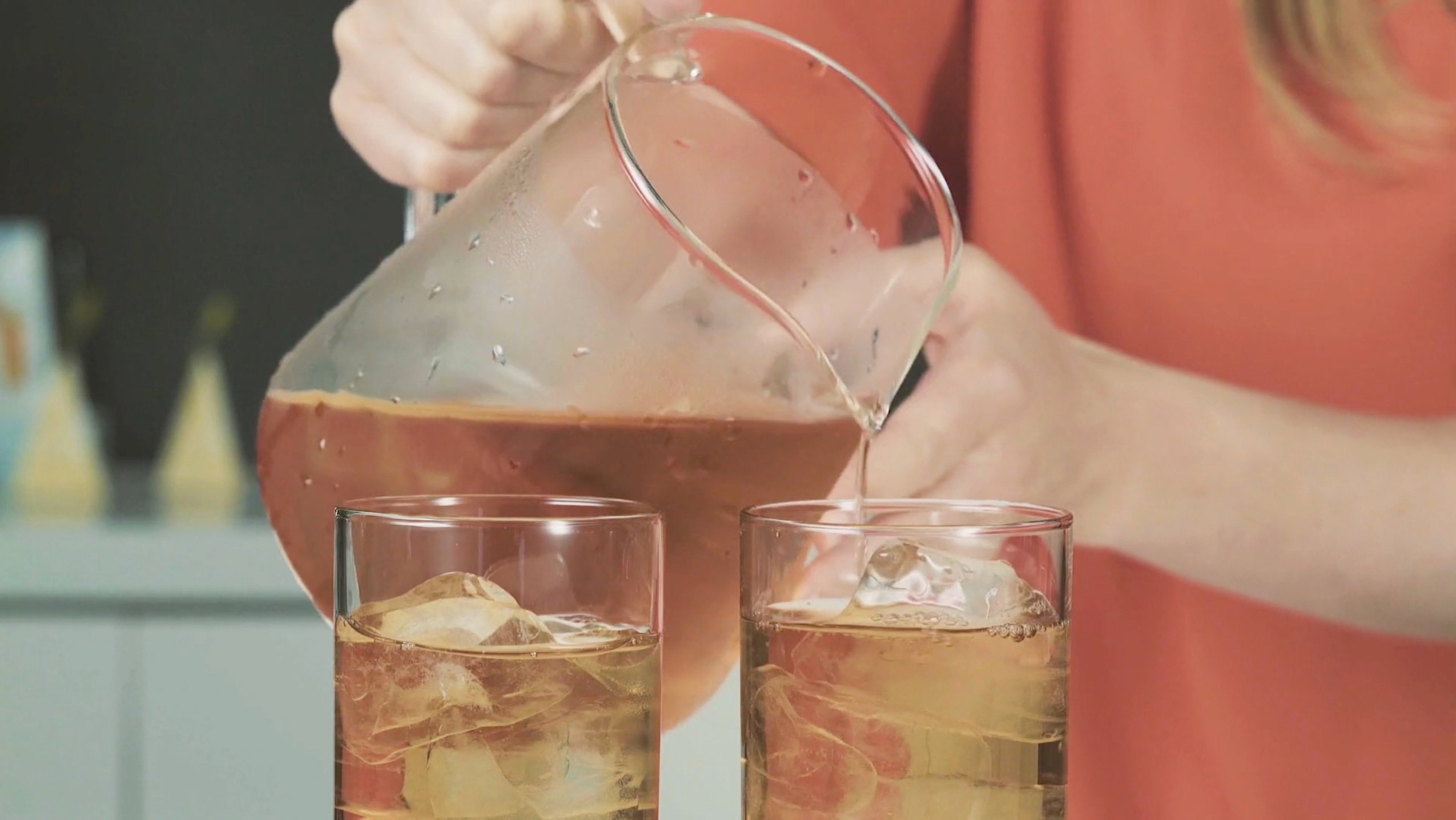 Step 7: Pouring the chilled tea into 2 highball glasses.