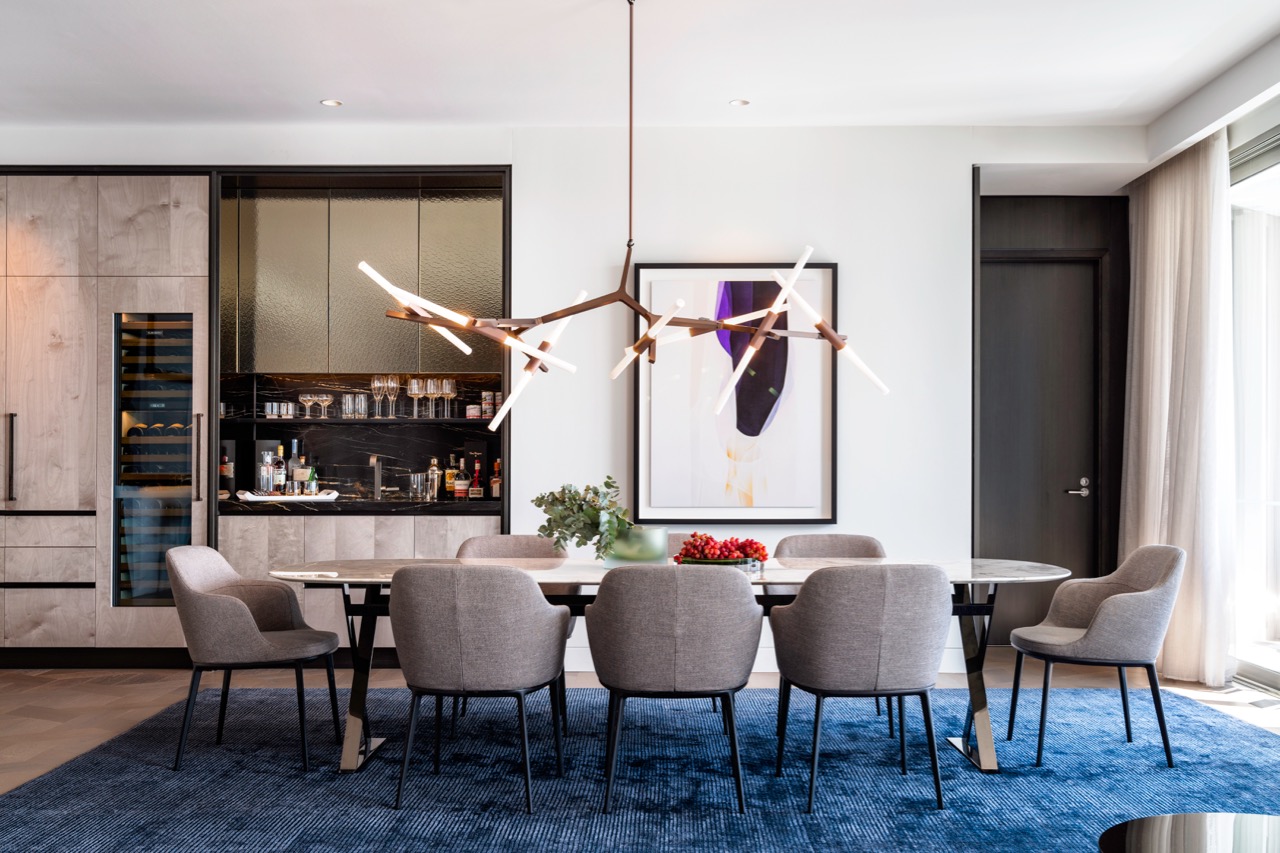 Inside the Crown Residences display suite, with the Agnes Light by New York-brand Roll & Hill; and Caratos Chairs and Pathos Table by Italian brand Maxalto. All photos © Justin Alexander. 
