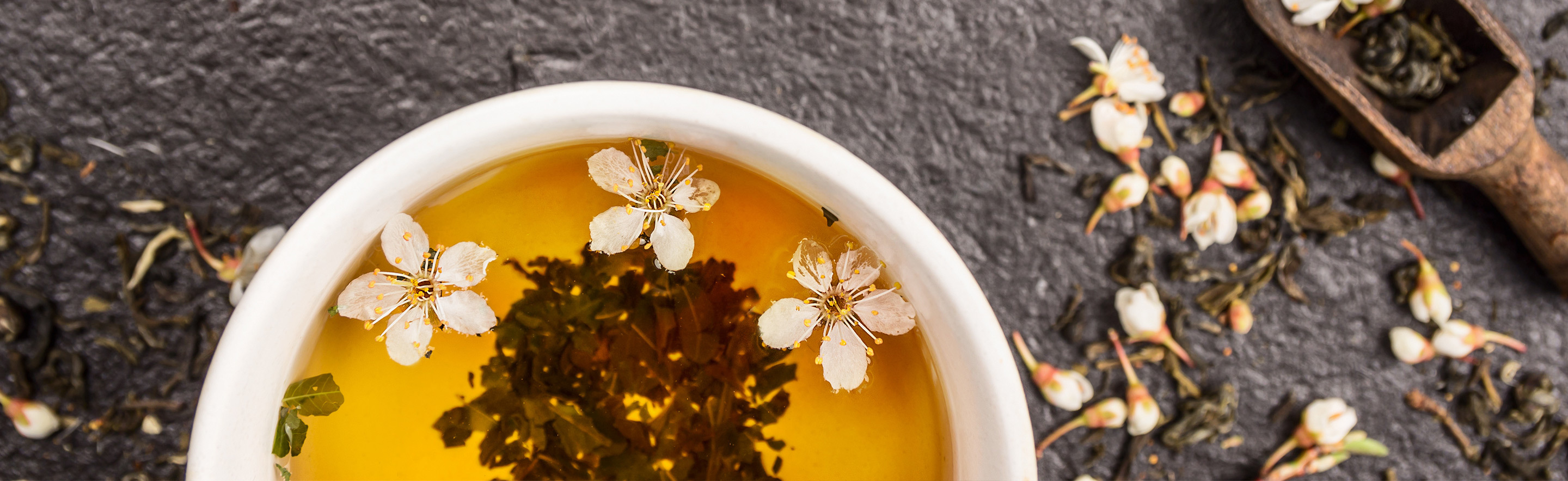 Jasmine tea with jasmine flowers floating on top