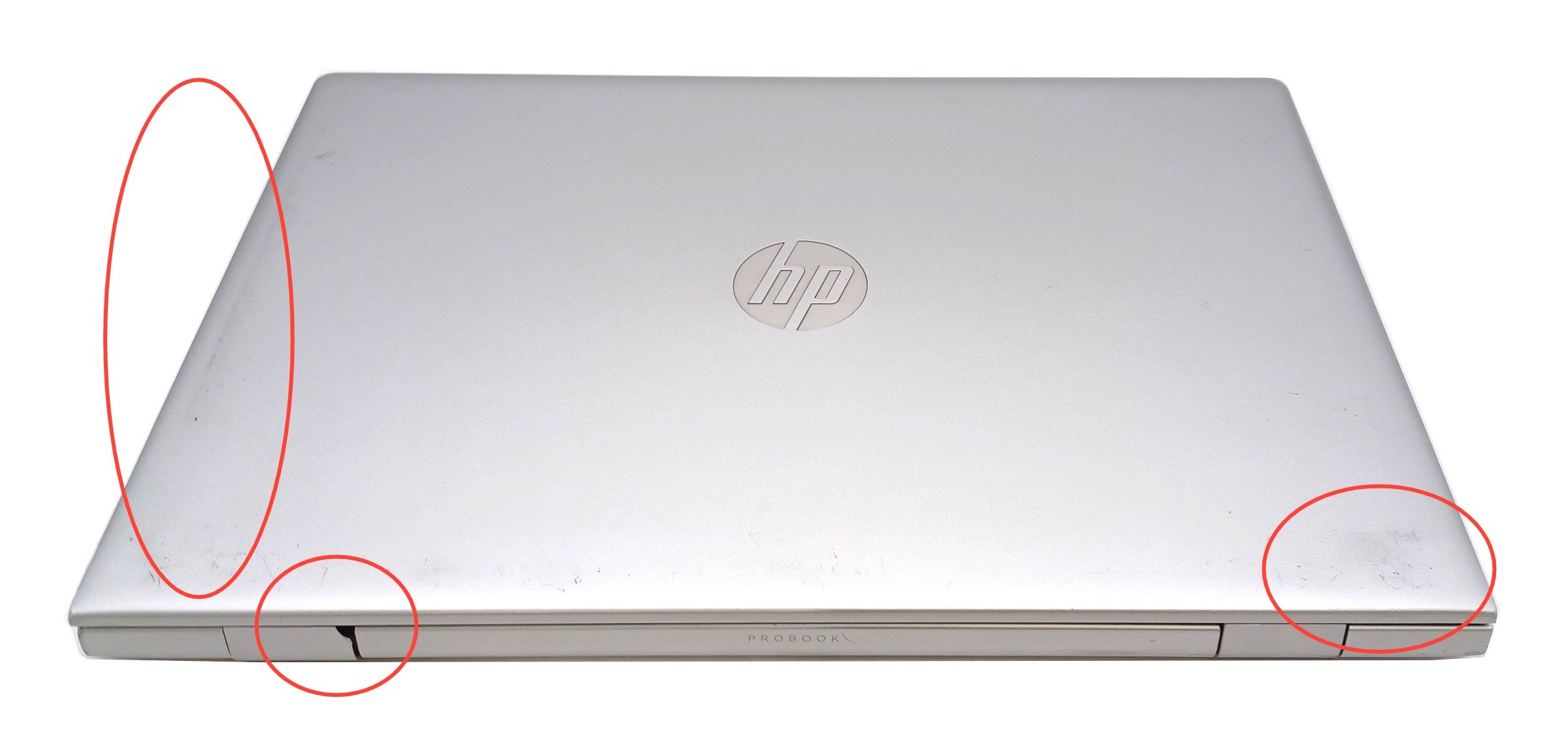 Device #1 - minor damage to hinge cover and scuffs on lid