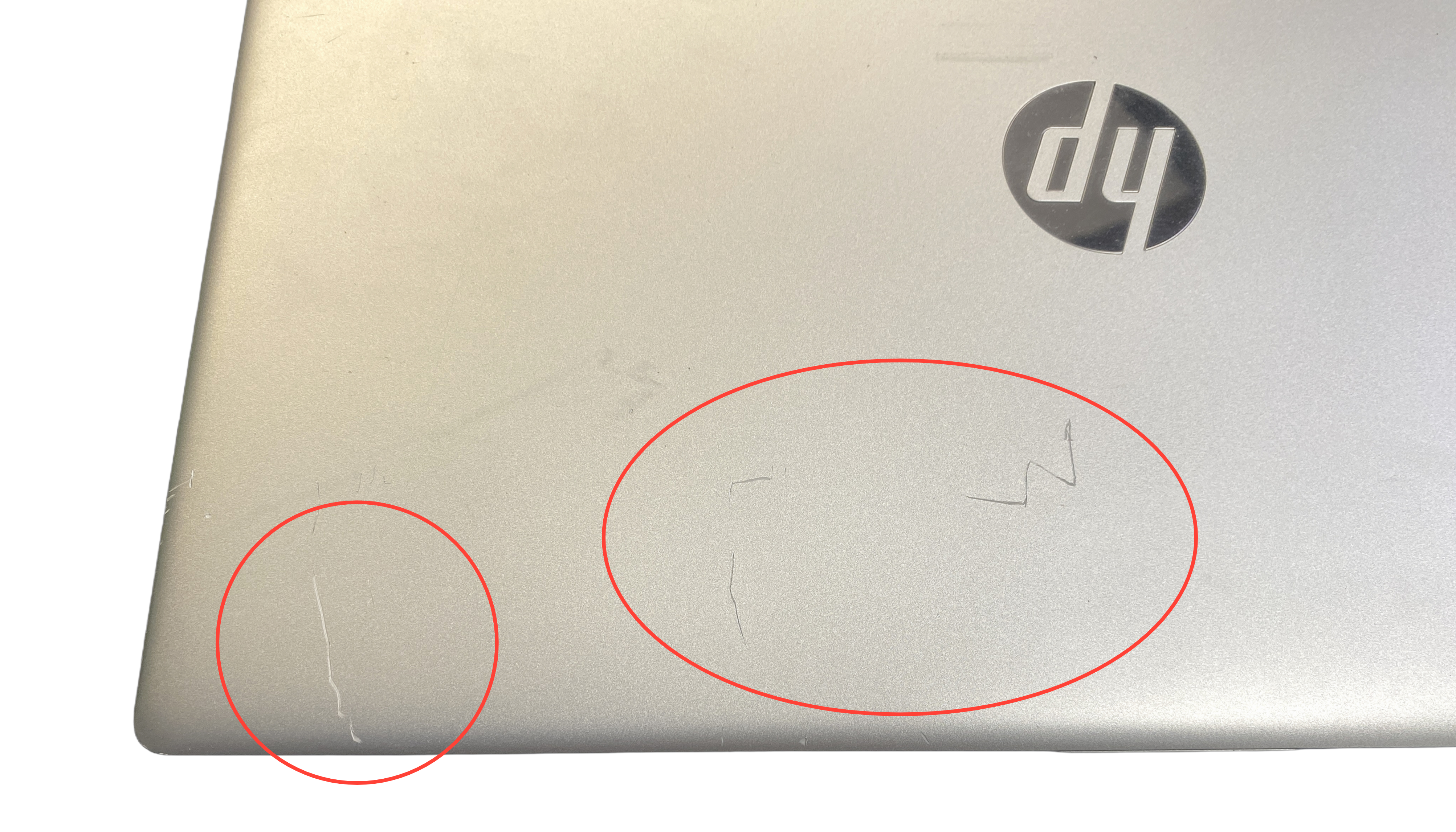 Device #1 - Deep scratches on lid
