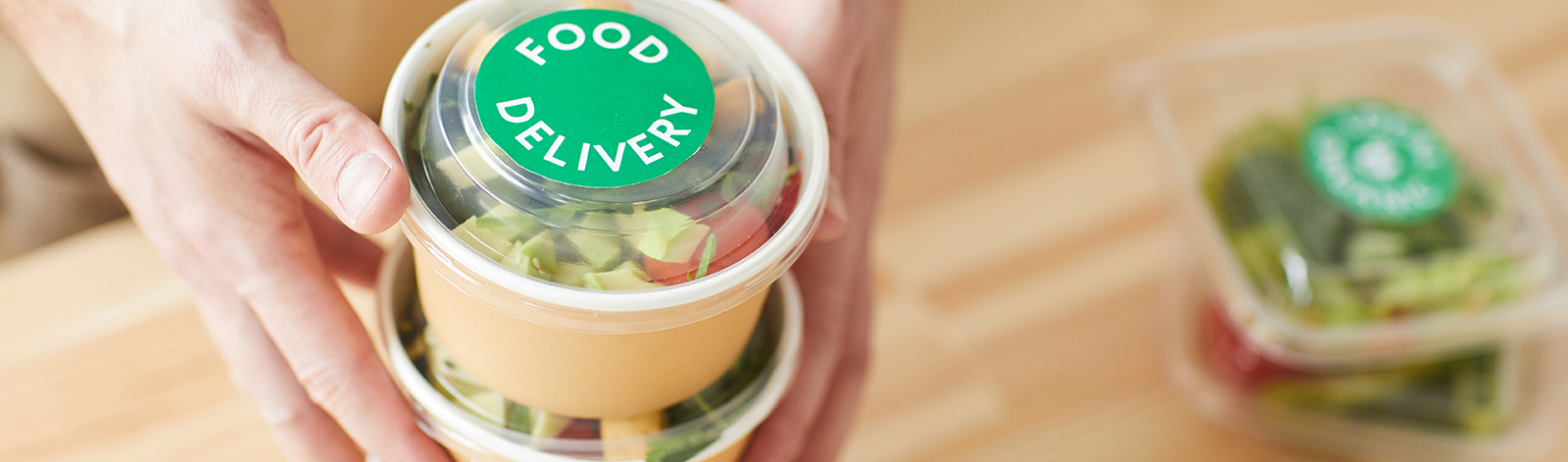 Waiter packaging food delivery orders