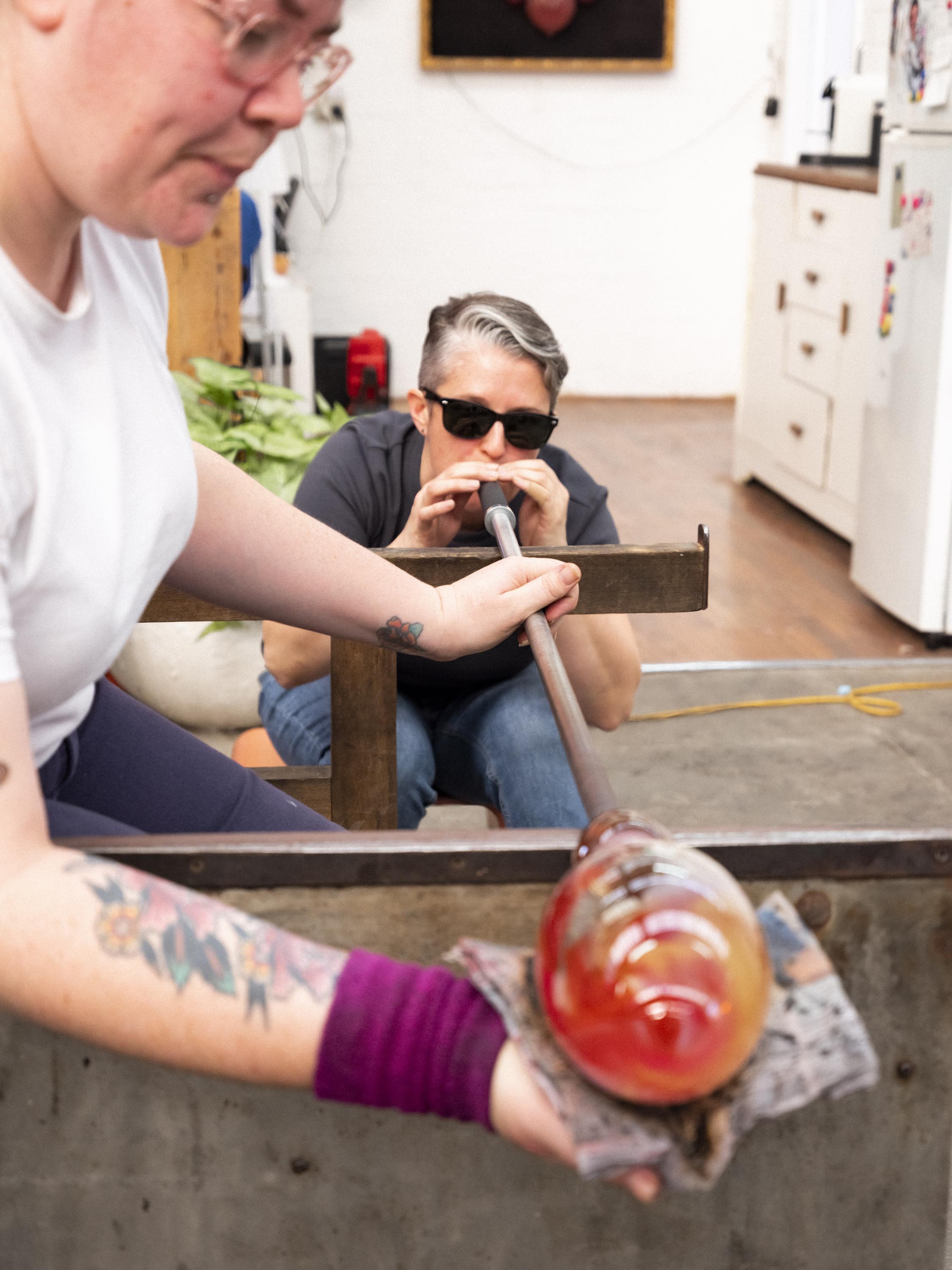 Blowing the glass into the final vase shape