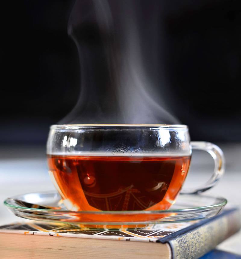 Steaming glass cup of english breakfast tea