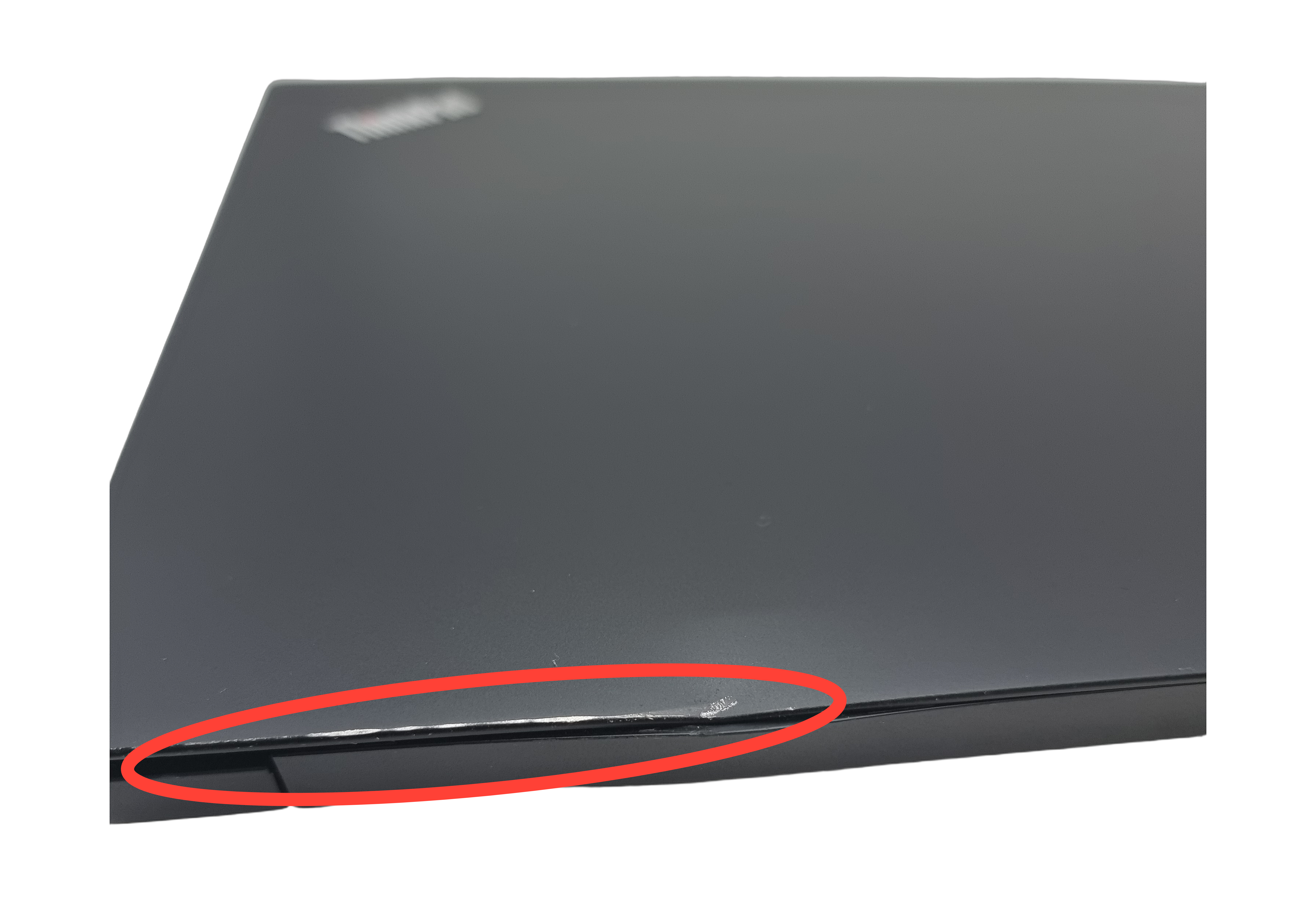 Device #2 - Small dent and scratches on rear of lid