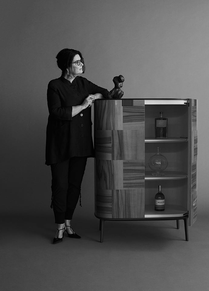 Portrait of Eileen Rickerby with her favourite piece from the collection, Maxalto's Tesaurus cabinet. Portrait © Tim Ashton. 