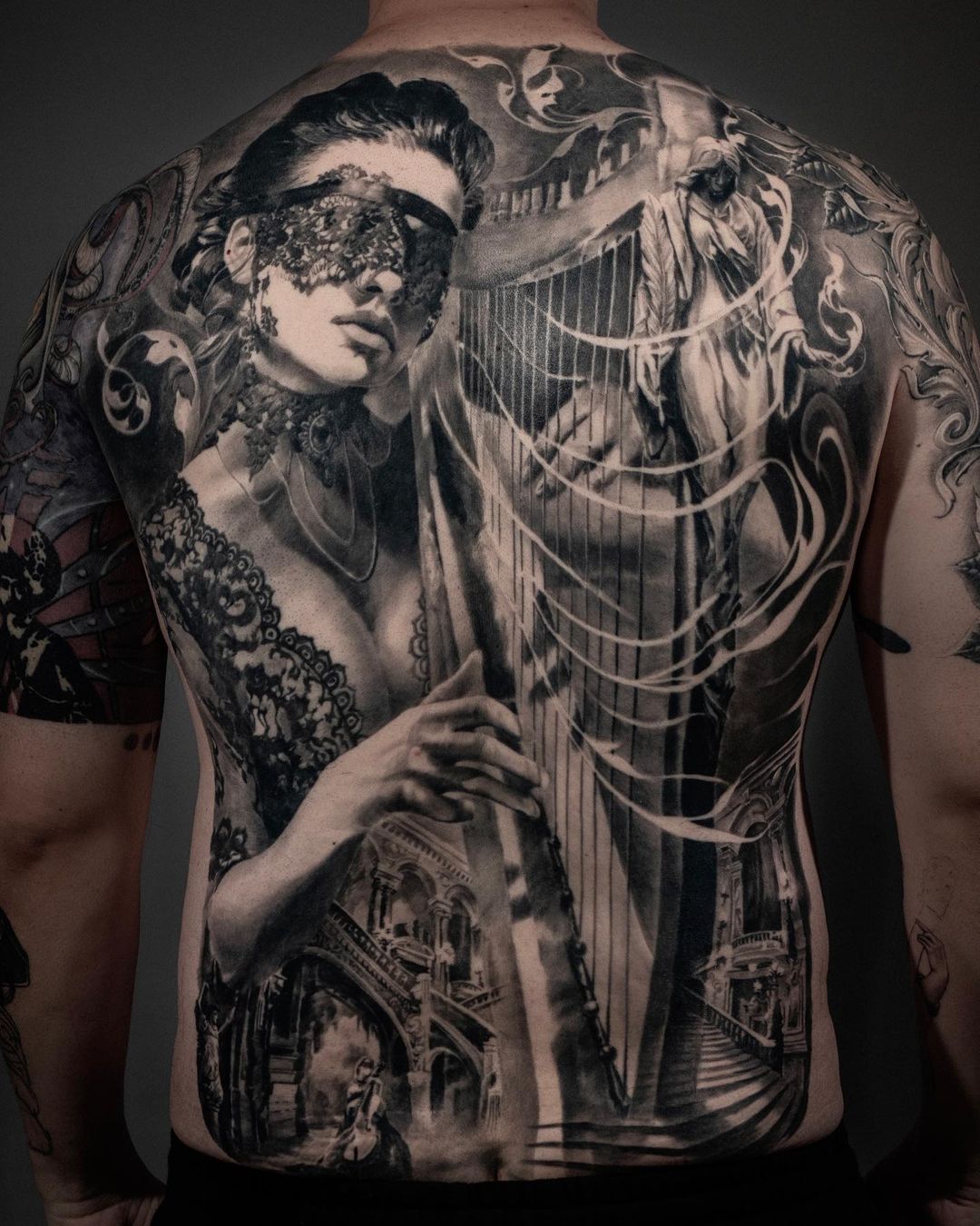 Carlos Torres back piece tattoo