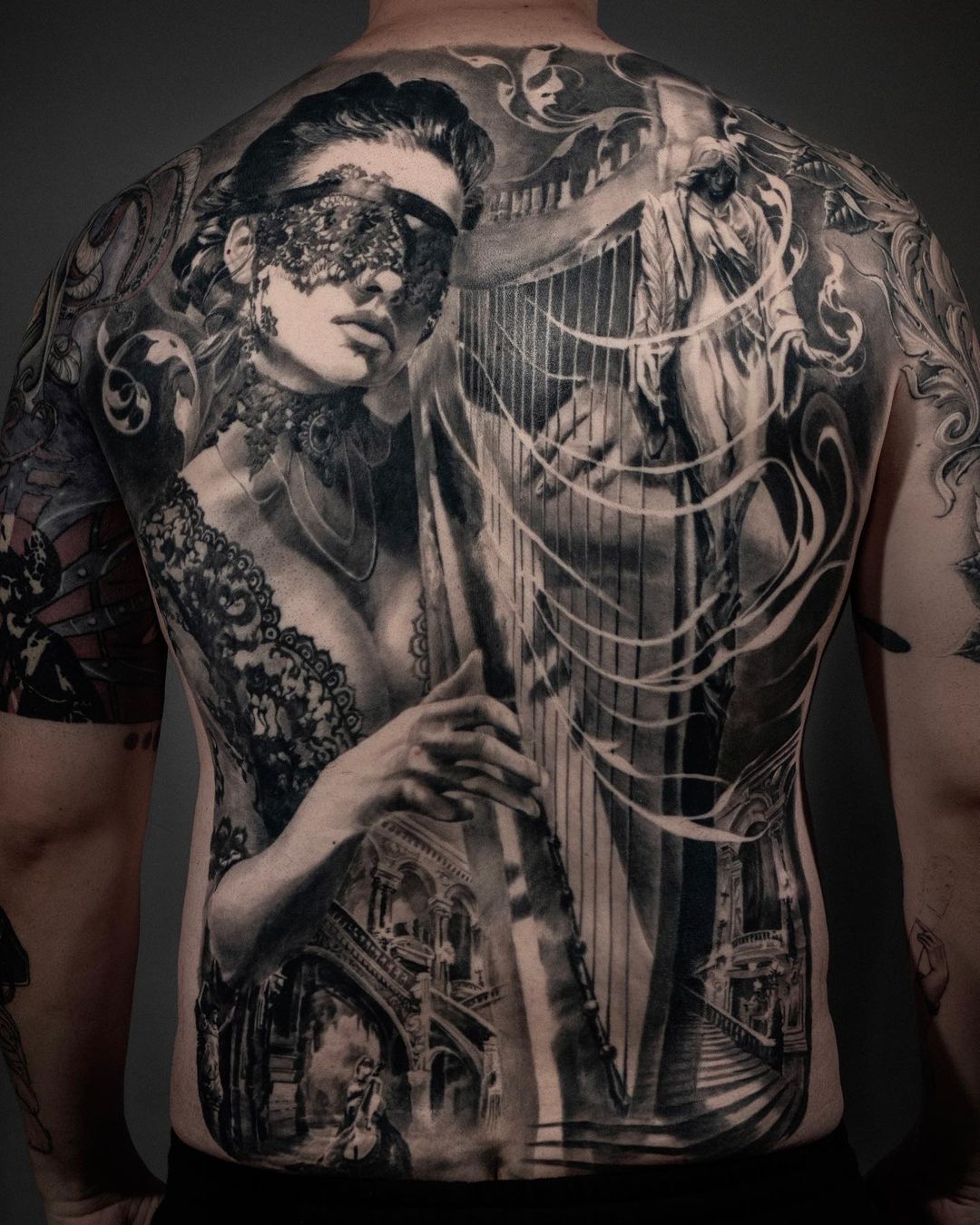 Carlos Torres back piece tattoo