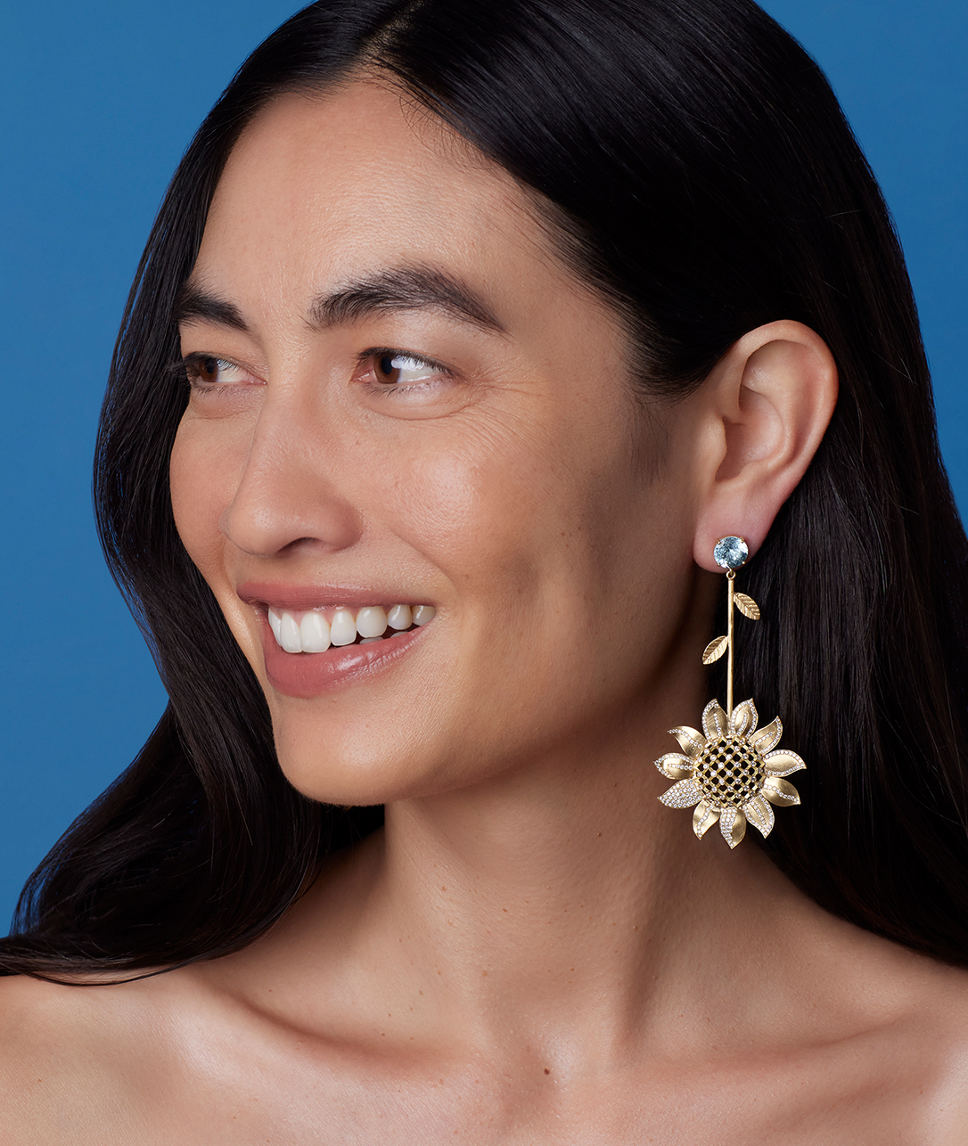                 Our new Golden Blossom Sunflower Earrings shine even brighter with an aquamarine accent.            