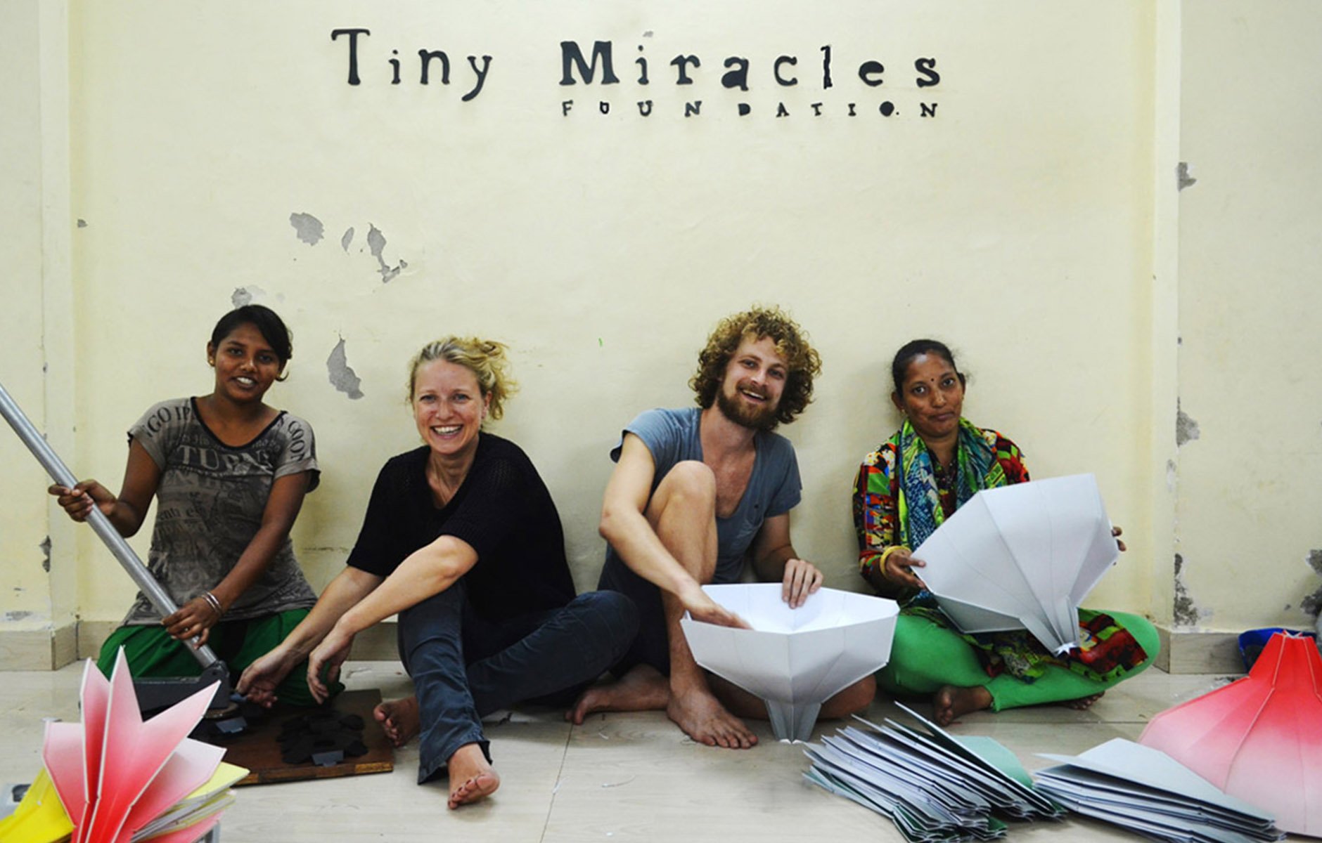 Philanthropist and founder of Tiny Miracles, Laurien Meuter, with designer Pepe Heykoop and members of the Paper Vase design team in Mumbai. Photo c/o Tiny Miracles. 