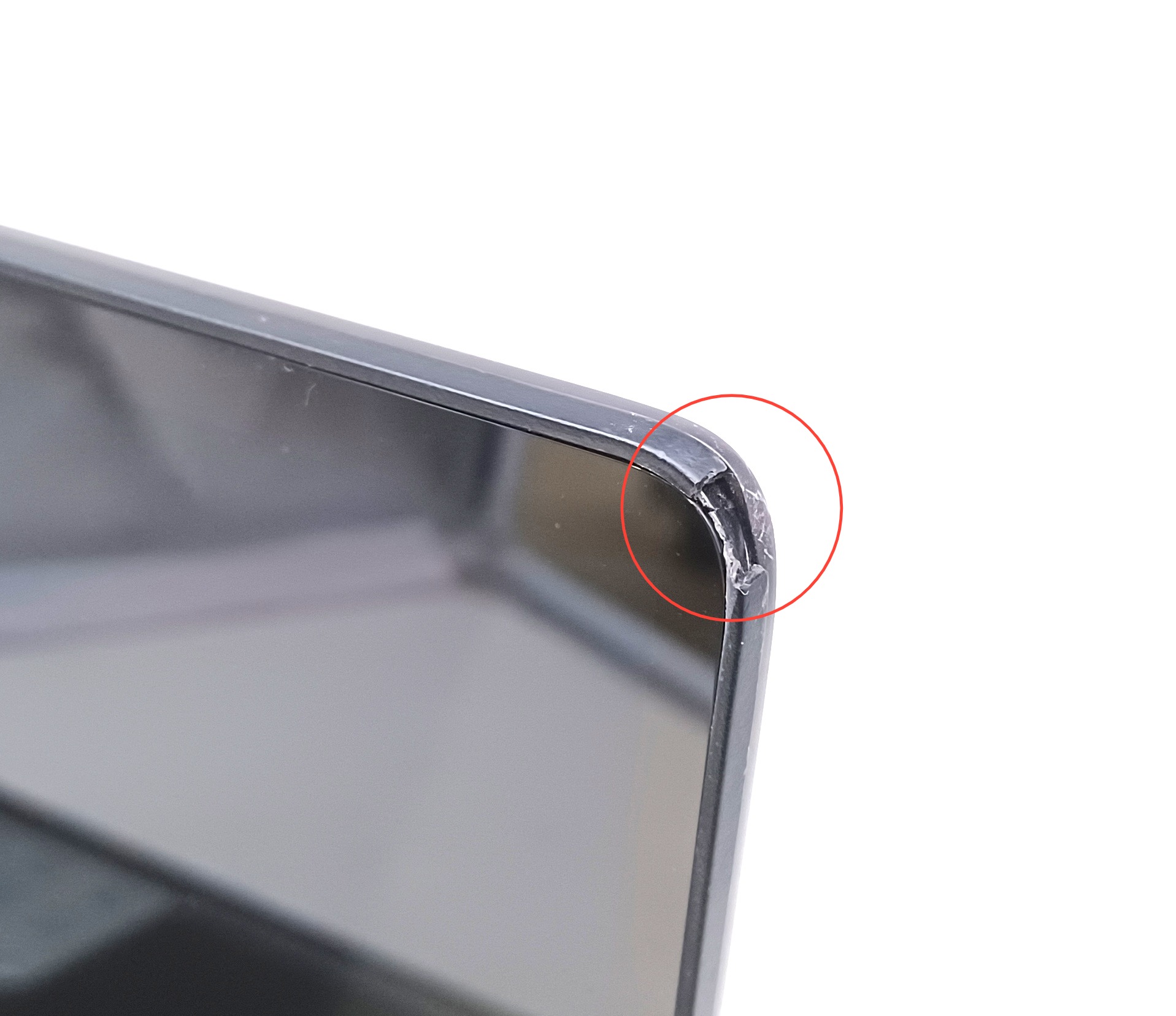 Device #1 - Chipped corner of lid (screen not effected)