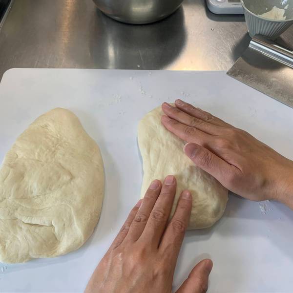 Smoothing out the dough balls 