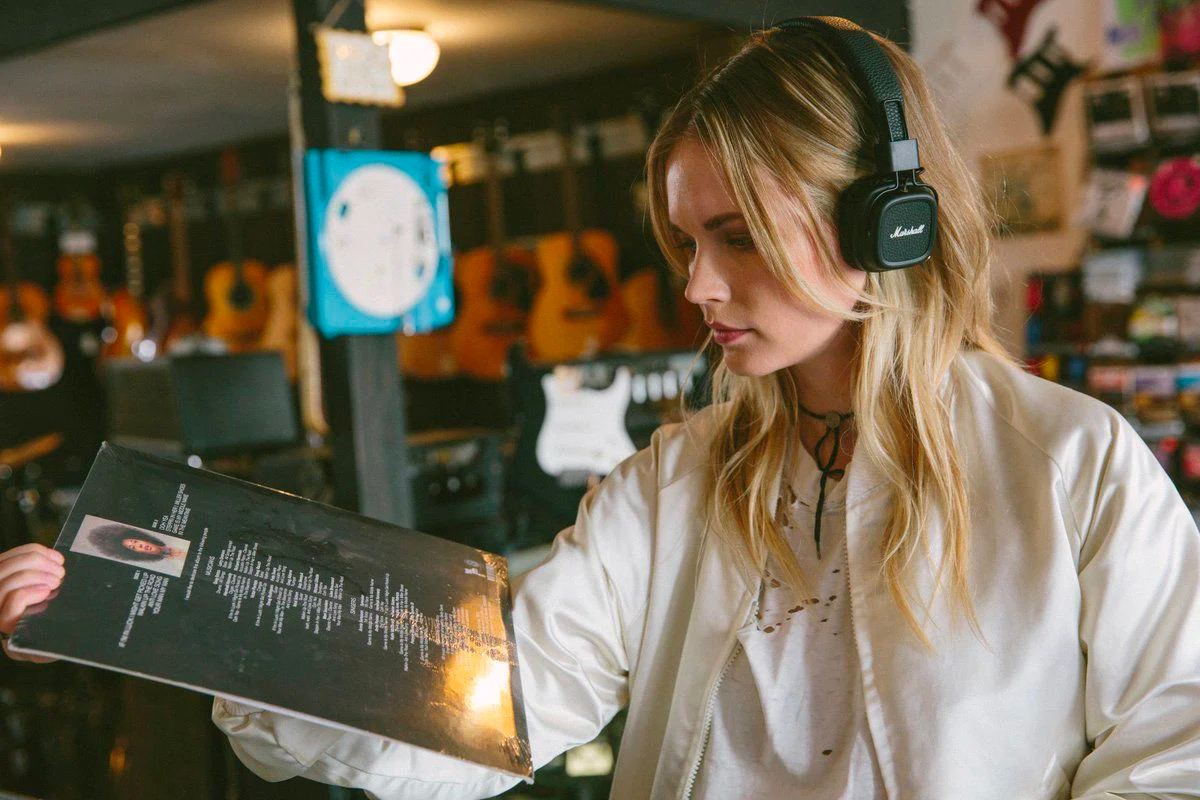 girl with major iv in a vinyl store