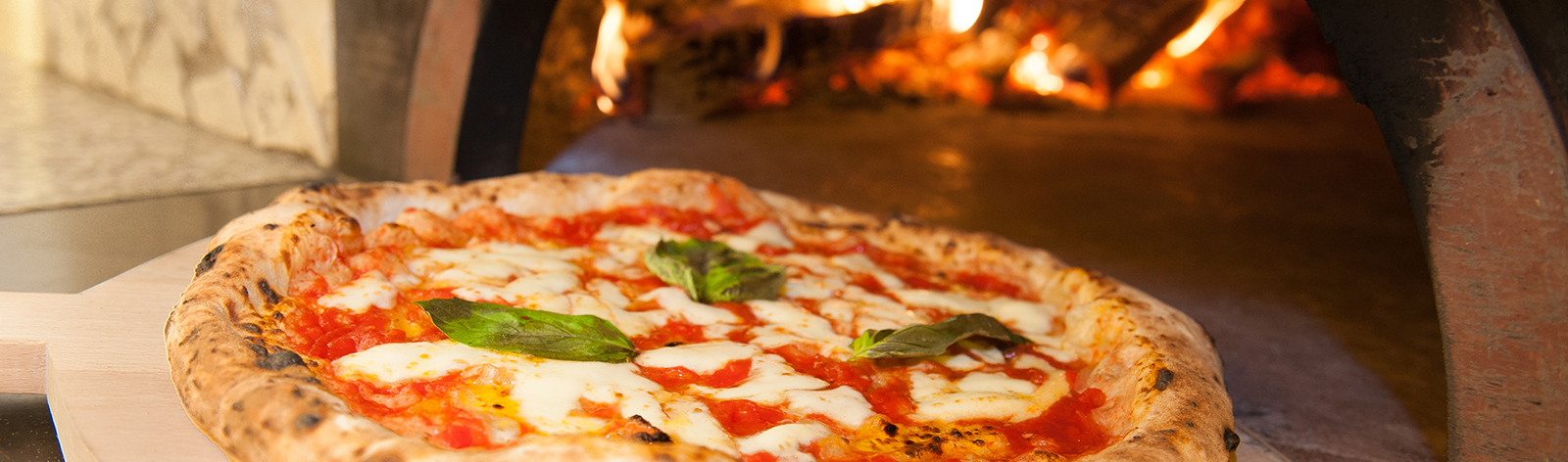 Margherita pizza fresh out of the wood-fired oven
