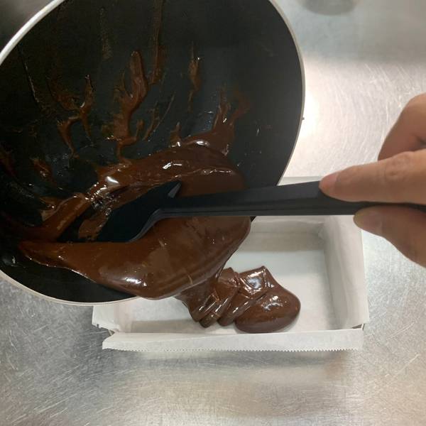 Pouring the chocolate ganache into the mold